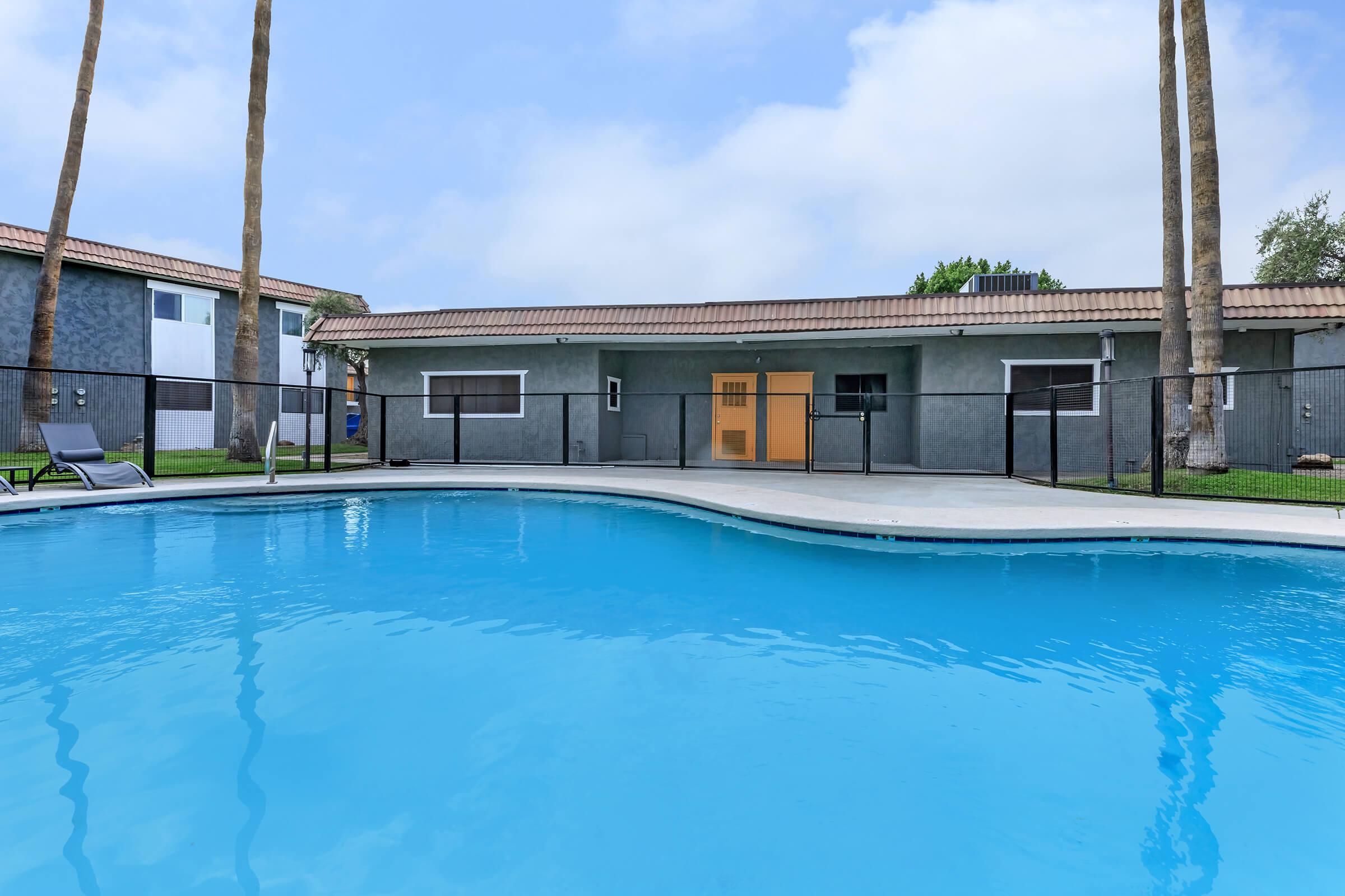 a large pool of water in front of a house