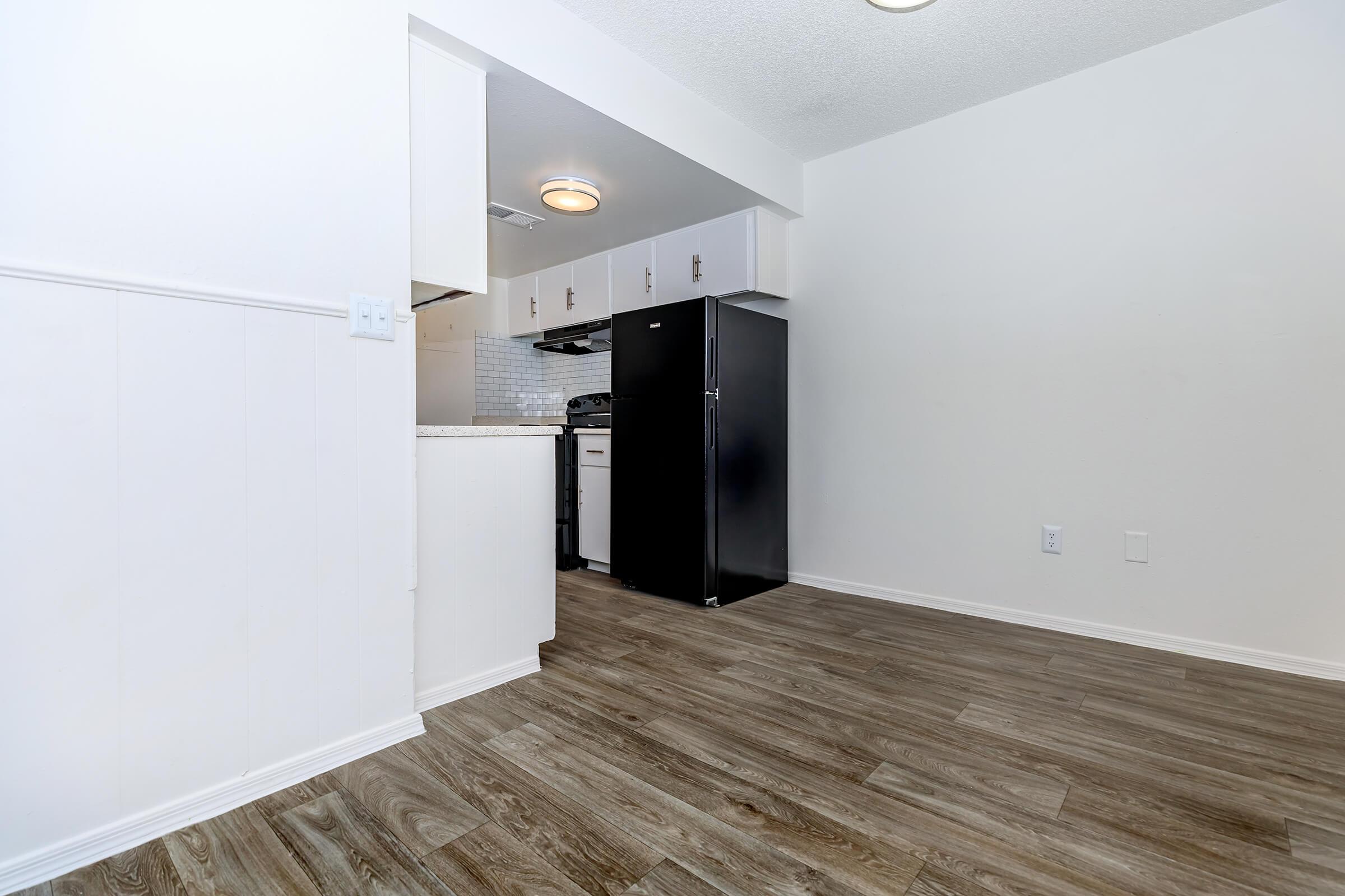 a kitchen with wooden cabinets