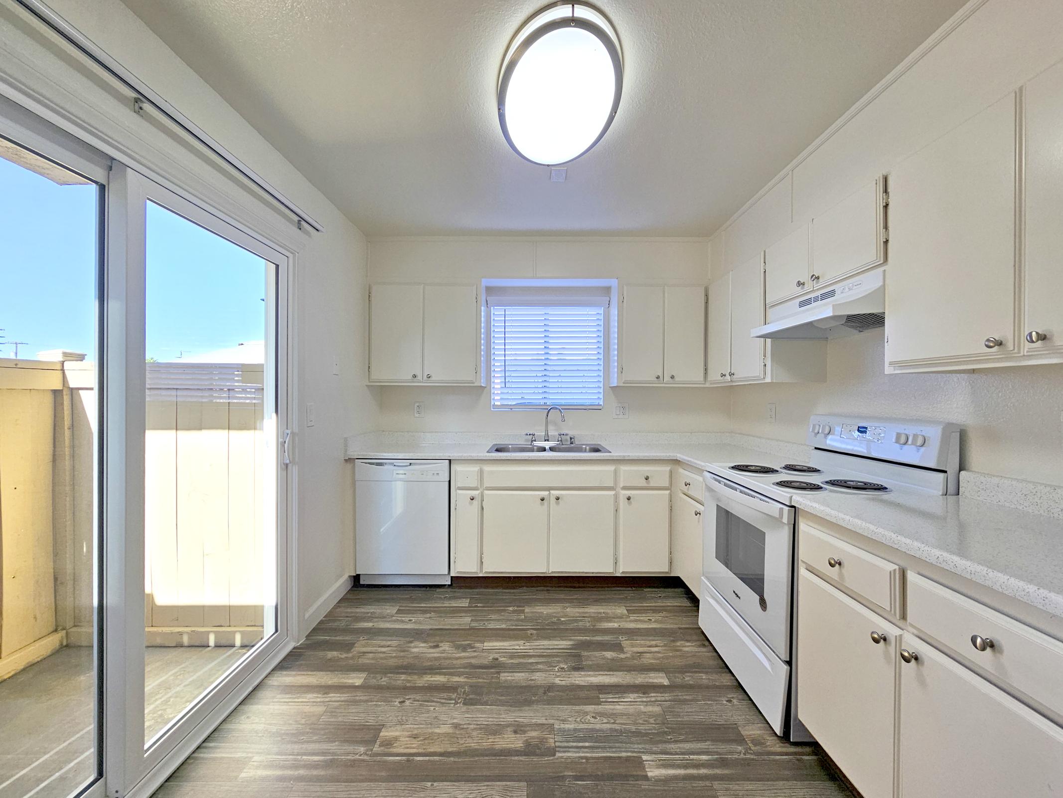 a kitchen with a large window