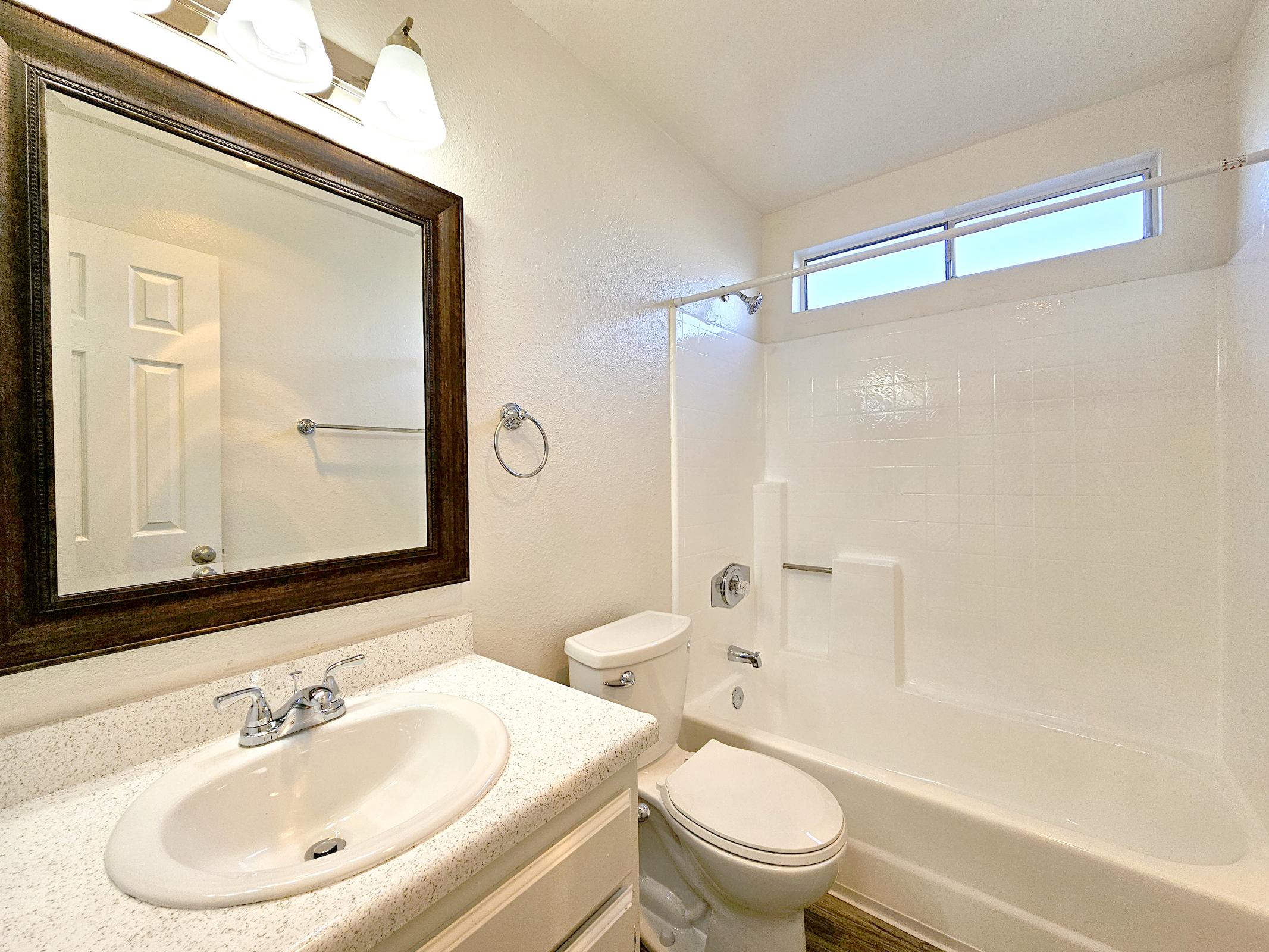 a restroom with a sink and a mirror