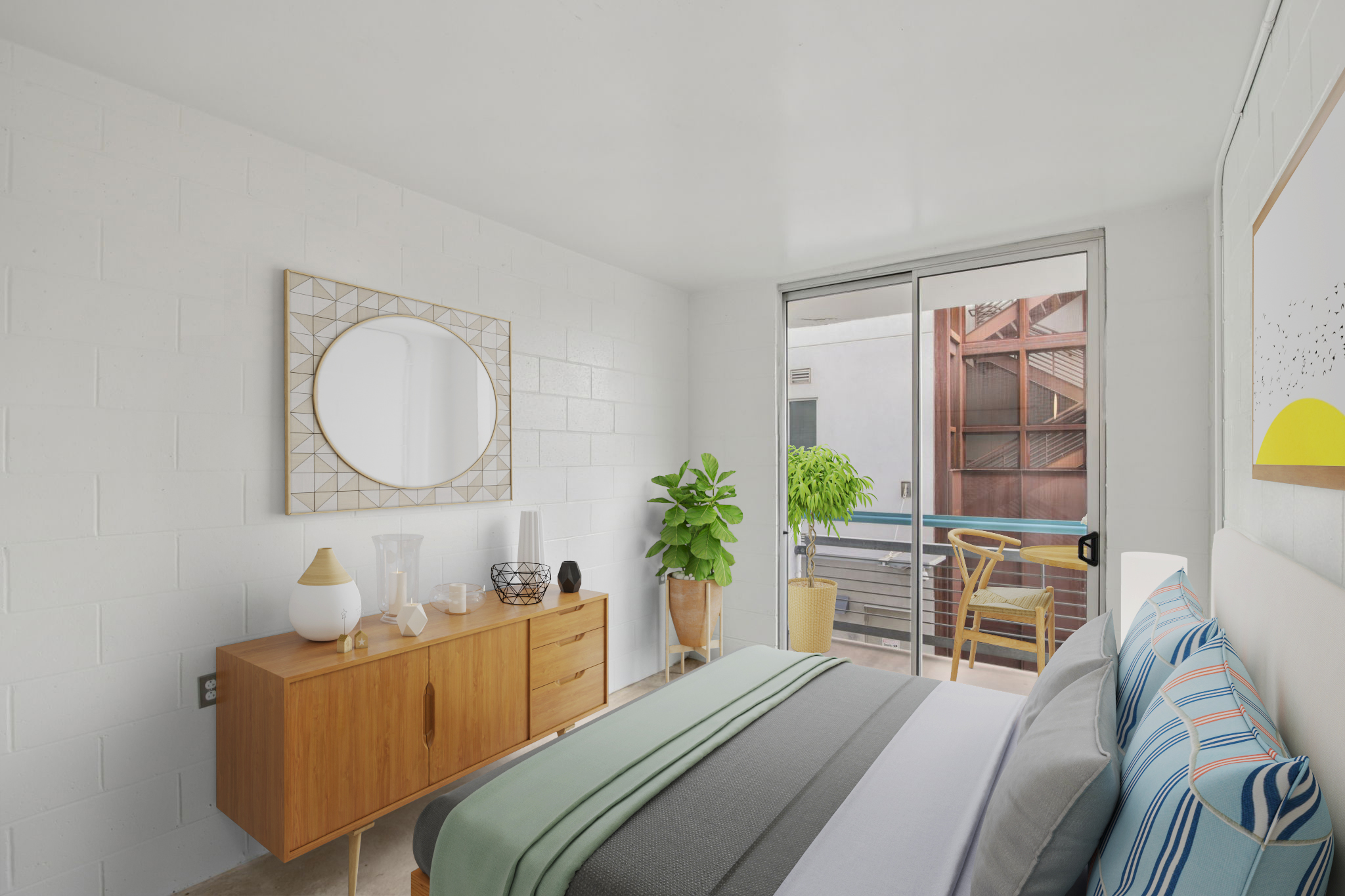 A modern bedroom featuring a bed with a striped blanket, a wooden dresser with decorative items, and a large mirror. A potted plant adds a touch of greenery, while a bright window offers natural light, revealing a small outdoor patio. The walls are painted white with a minimalist design.