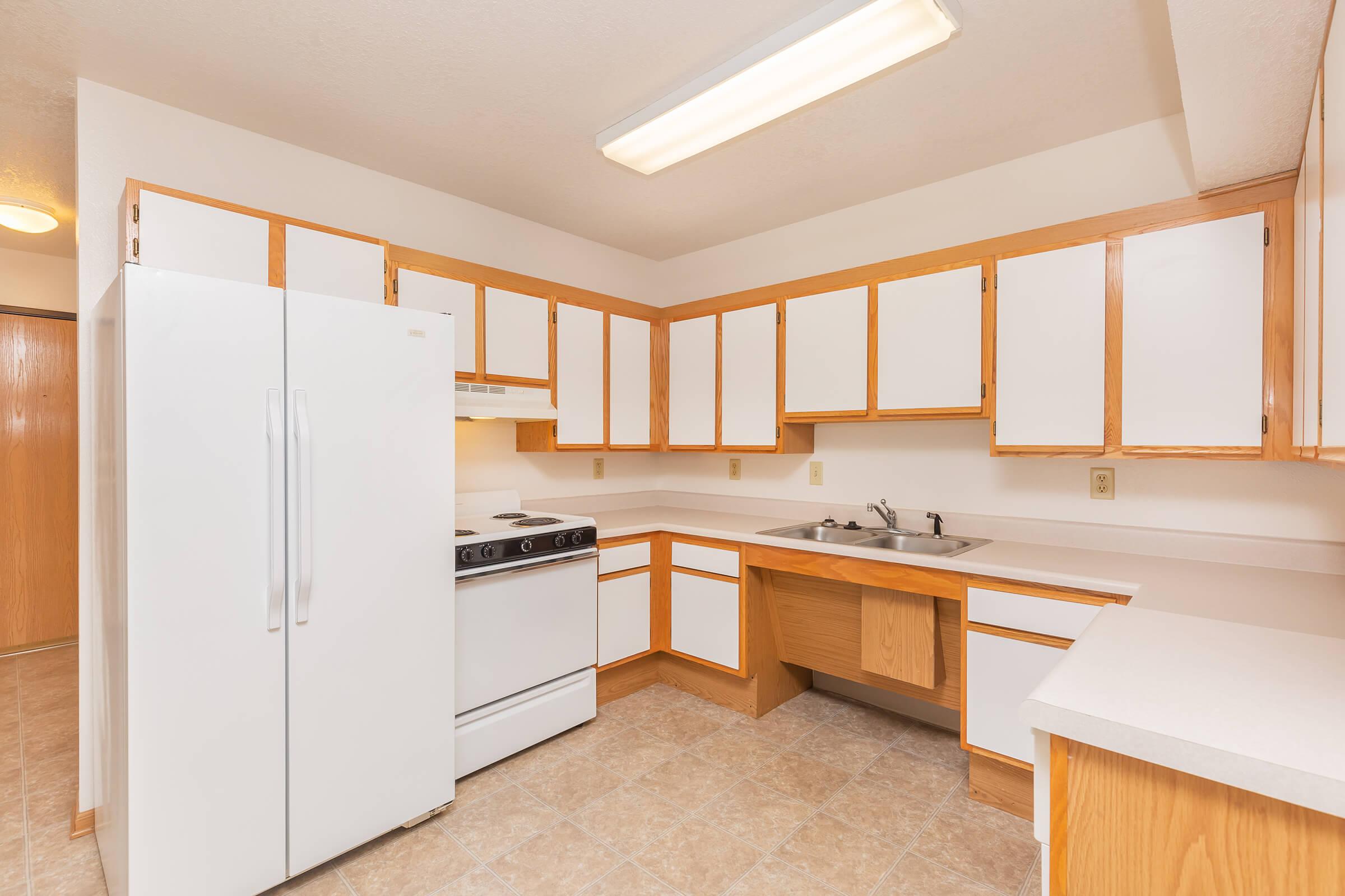 a kitchen with a wood floor