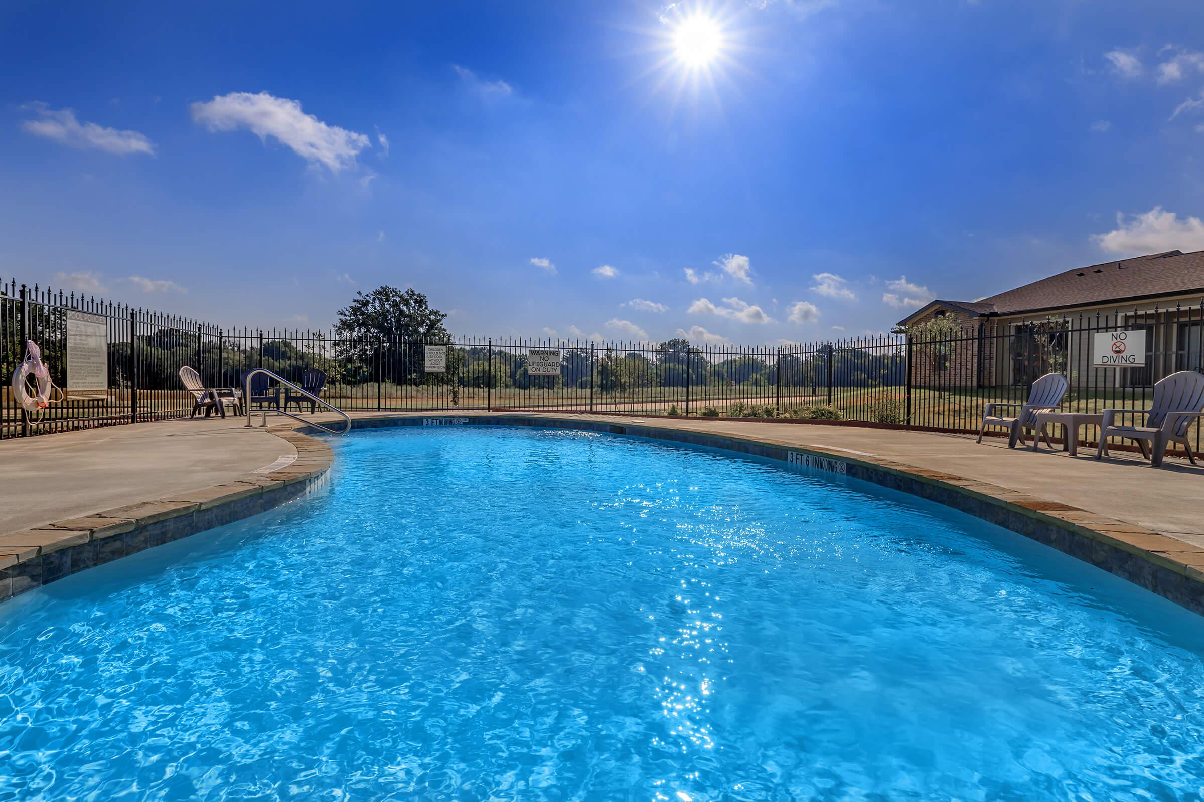 a pool next to a body of water