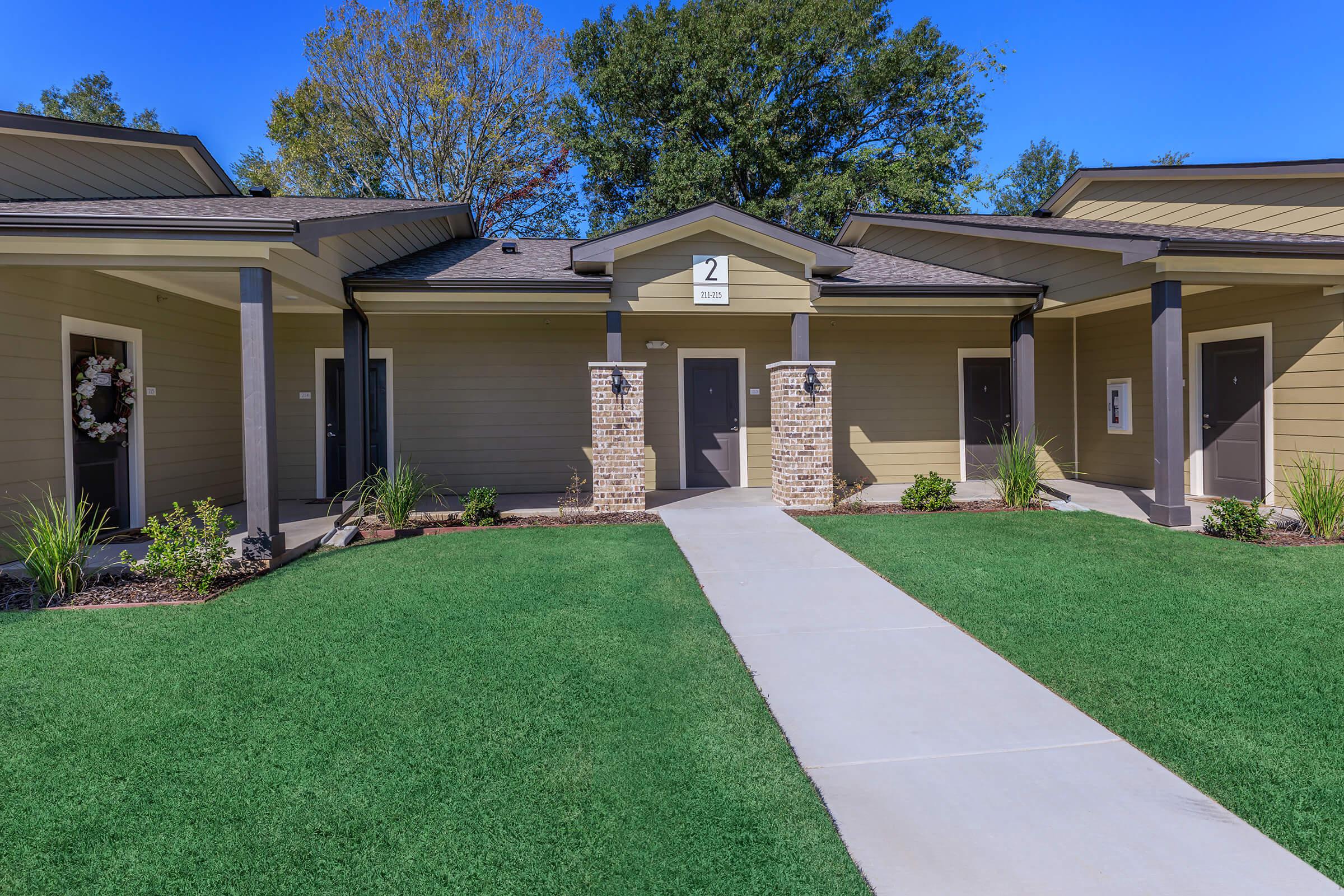 a large lawn in front of a house