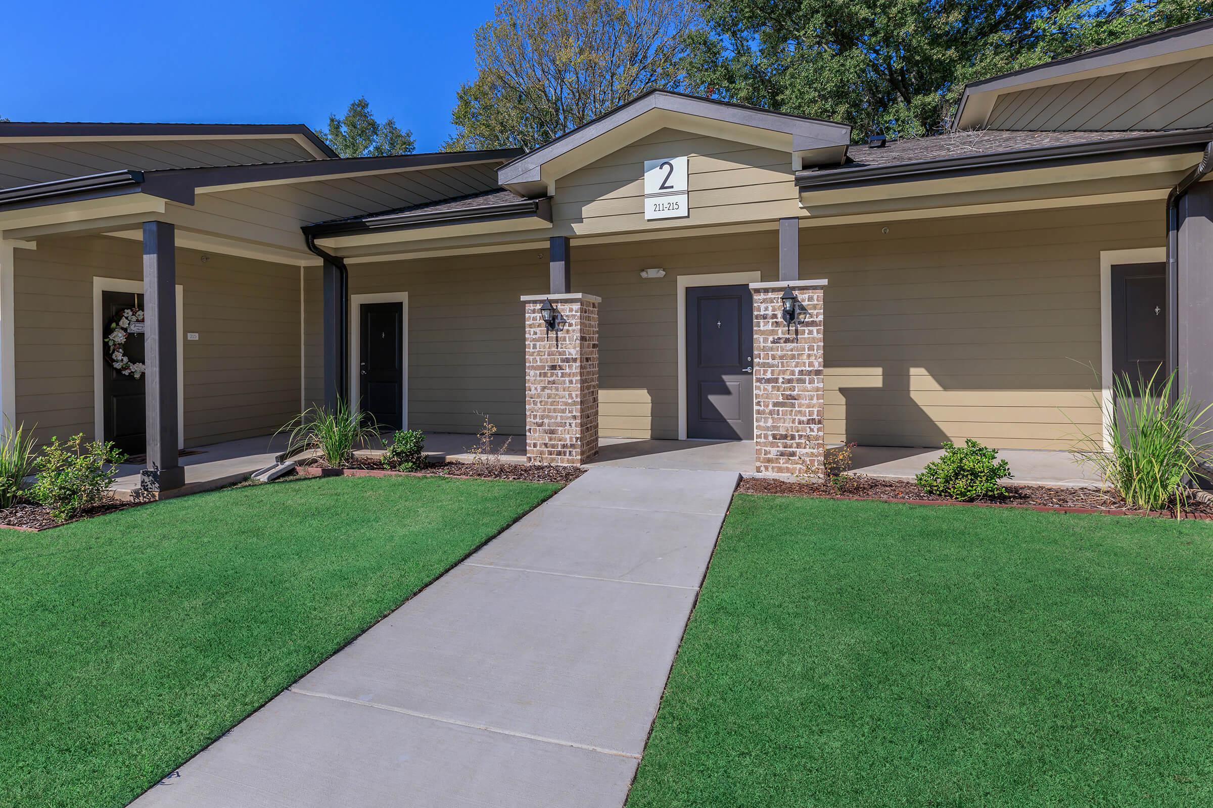 a large lawn in front of a house