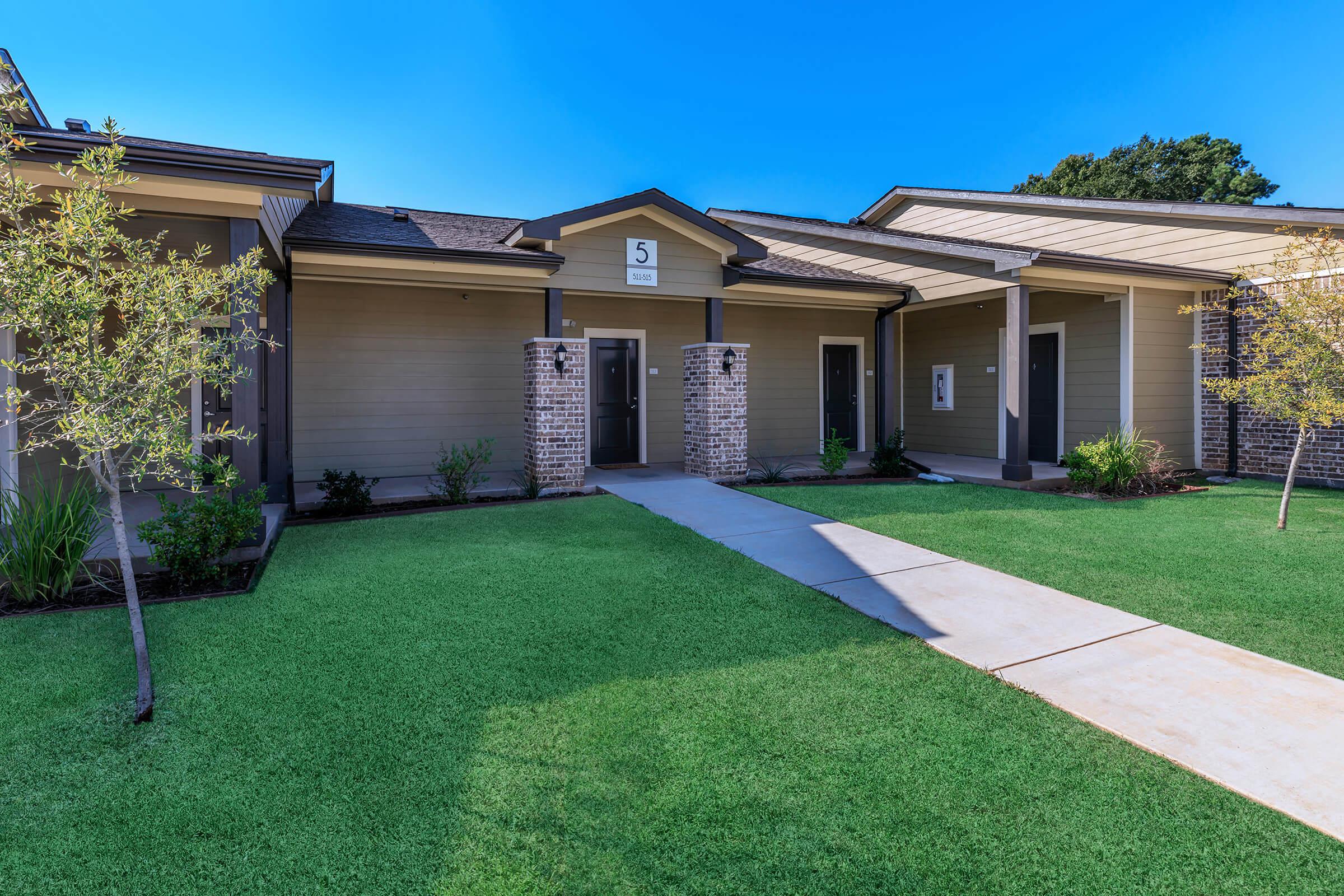 a large lawn in front of a house