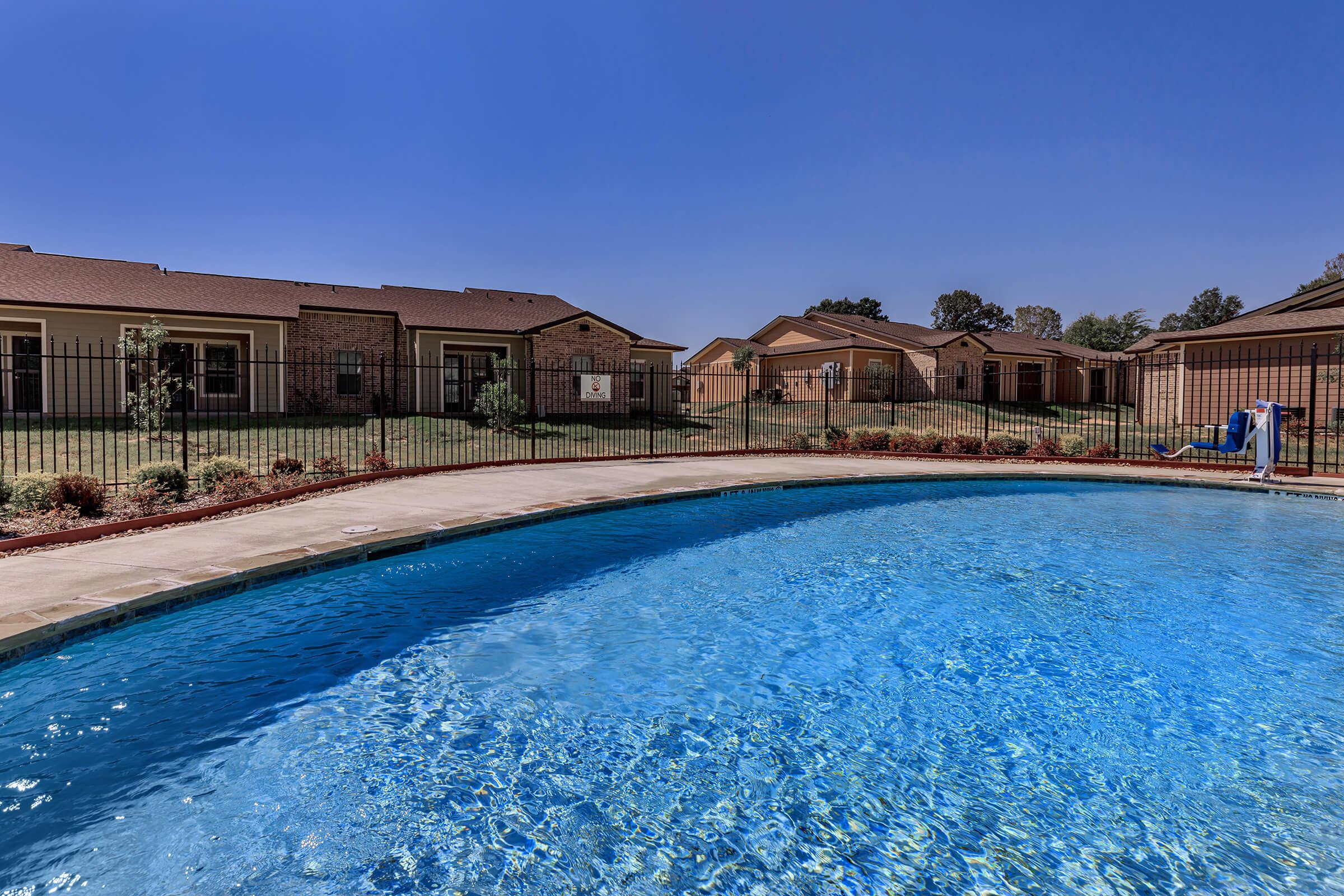 a pool next to a body of water