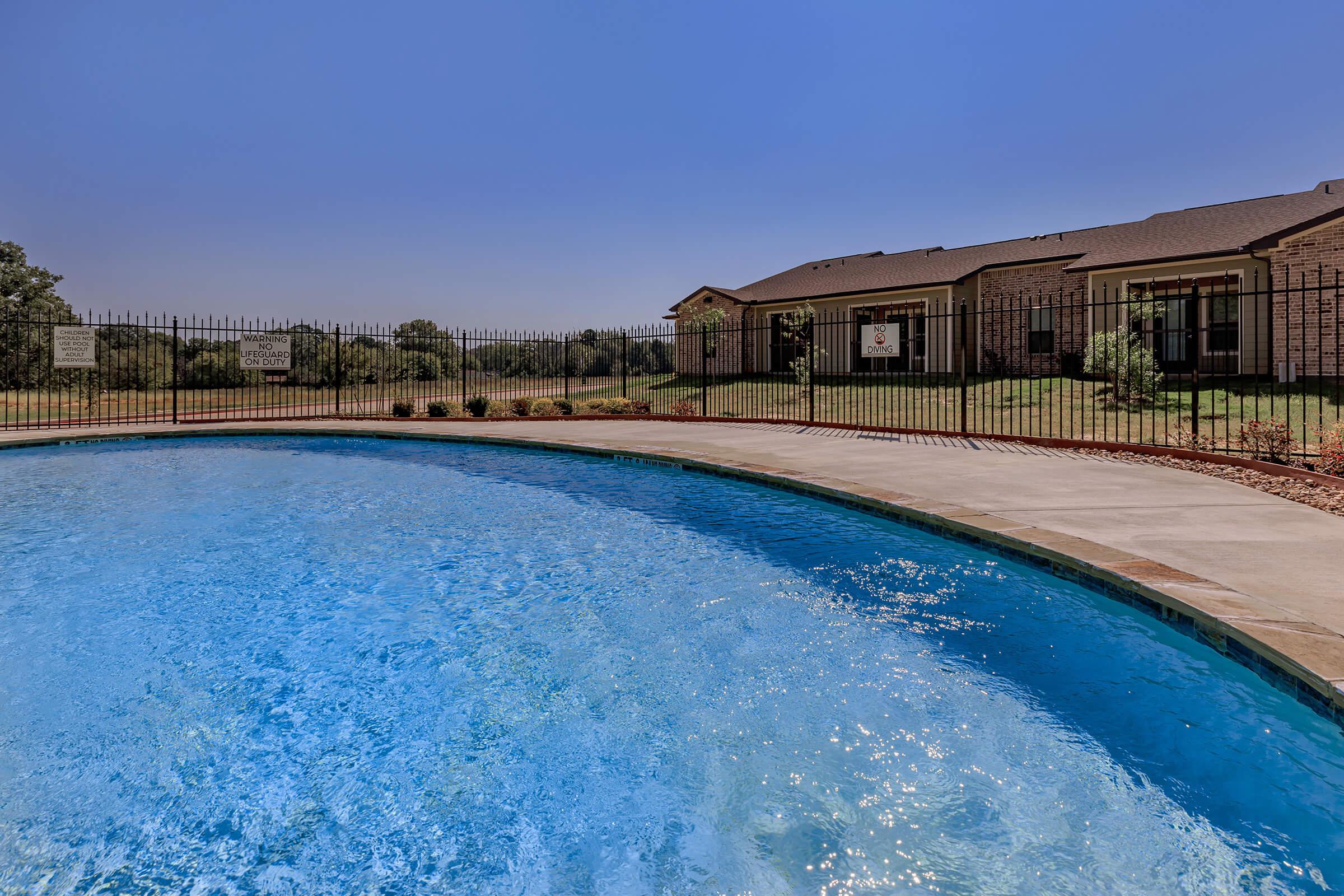 a pool next to a body of water