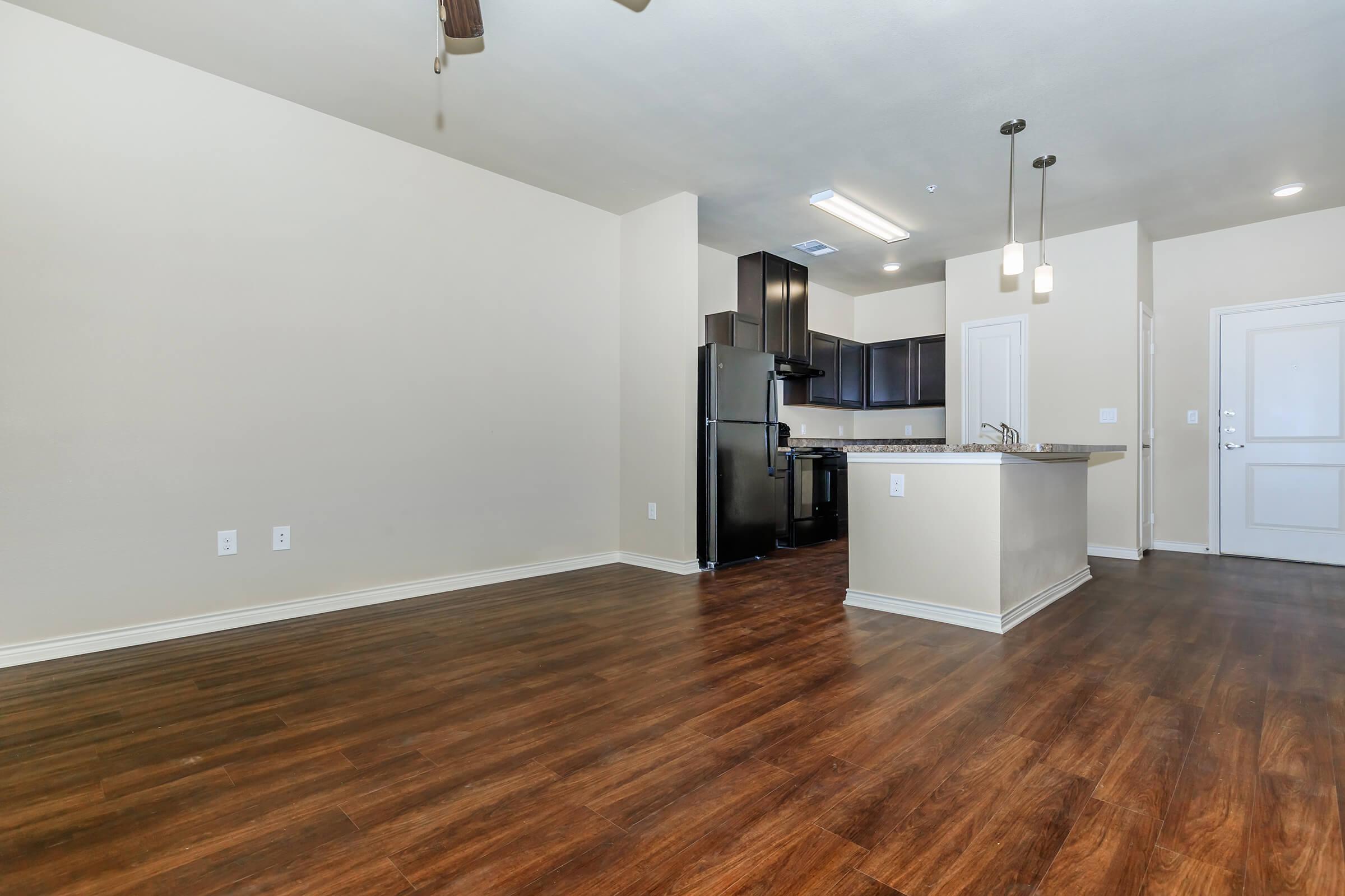 a kitchen with a wood floor