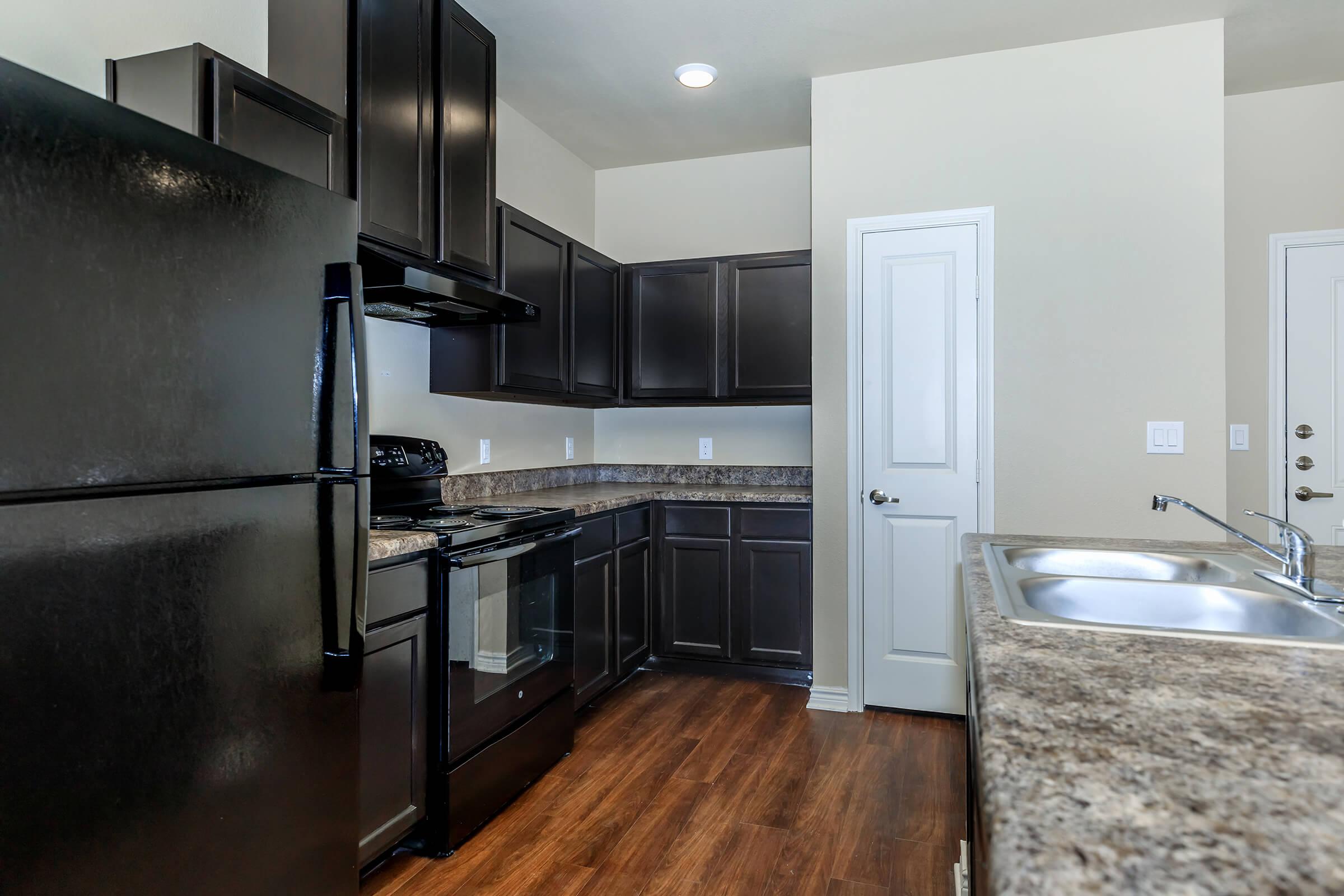 a modern kitchen with stainless steel appliances