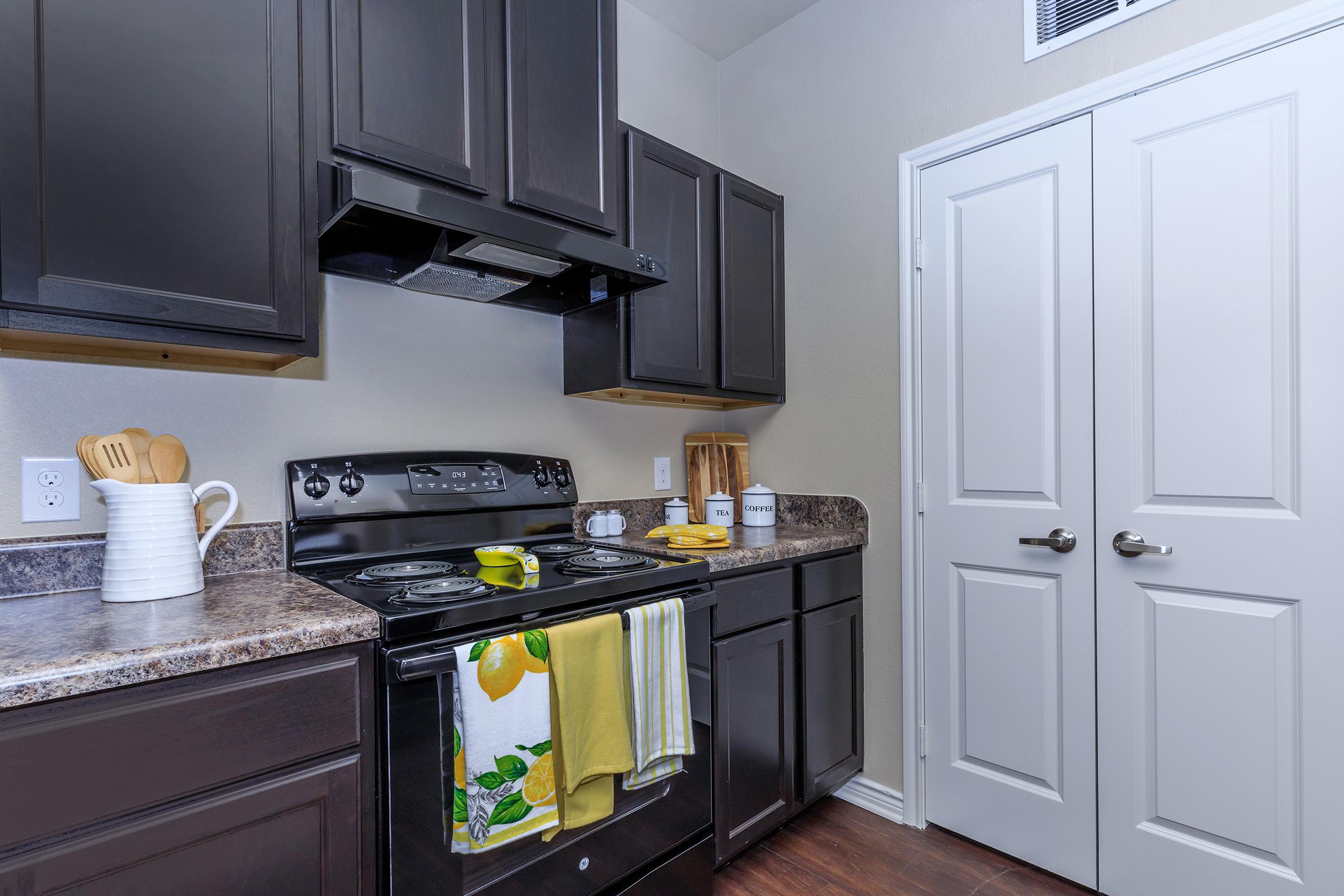 a kitchen with a sink and a refrigerator