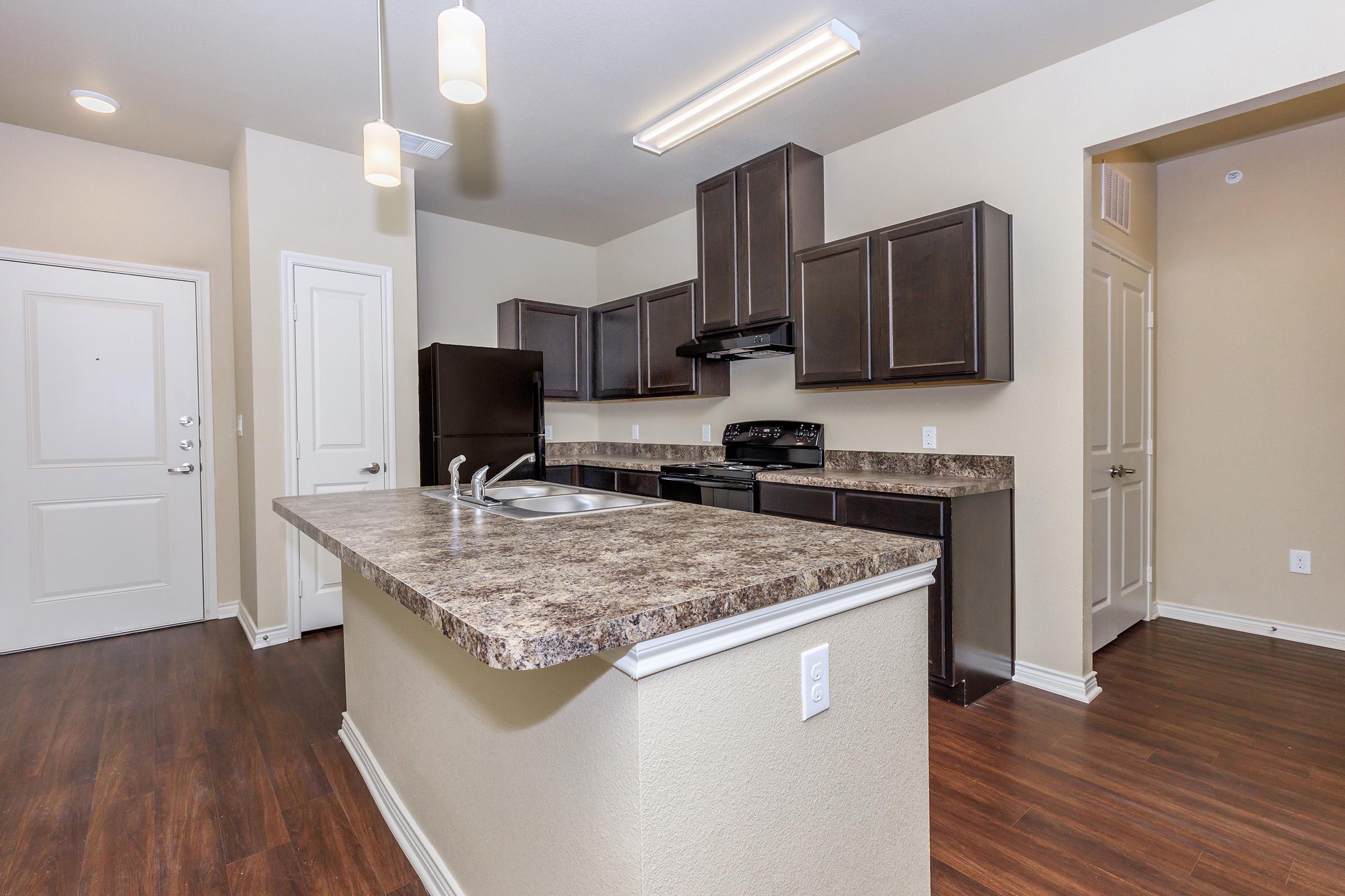 a modern kitchen with stainless steel appliances