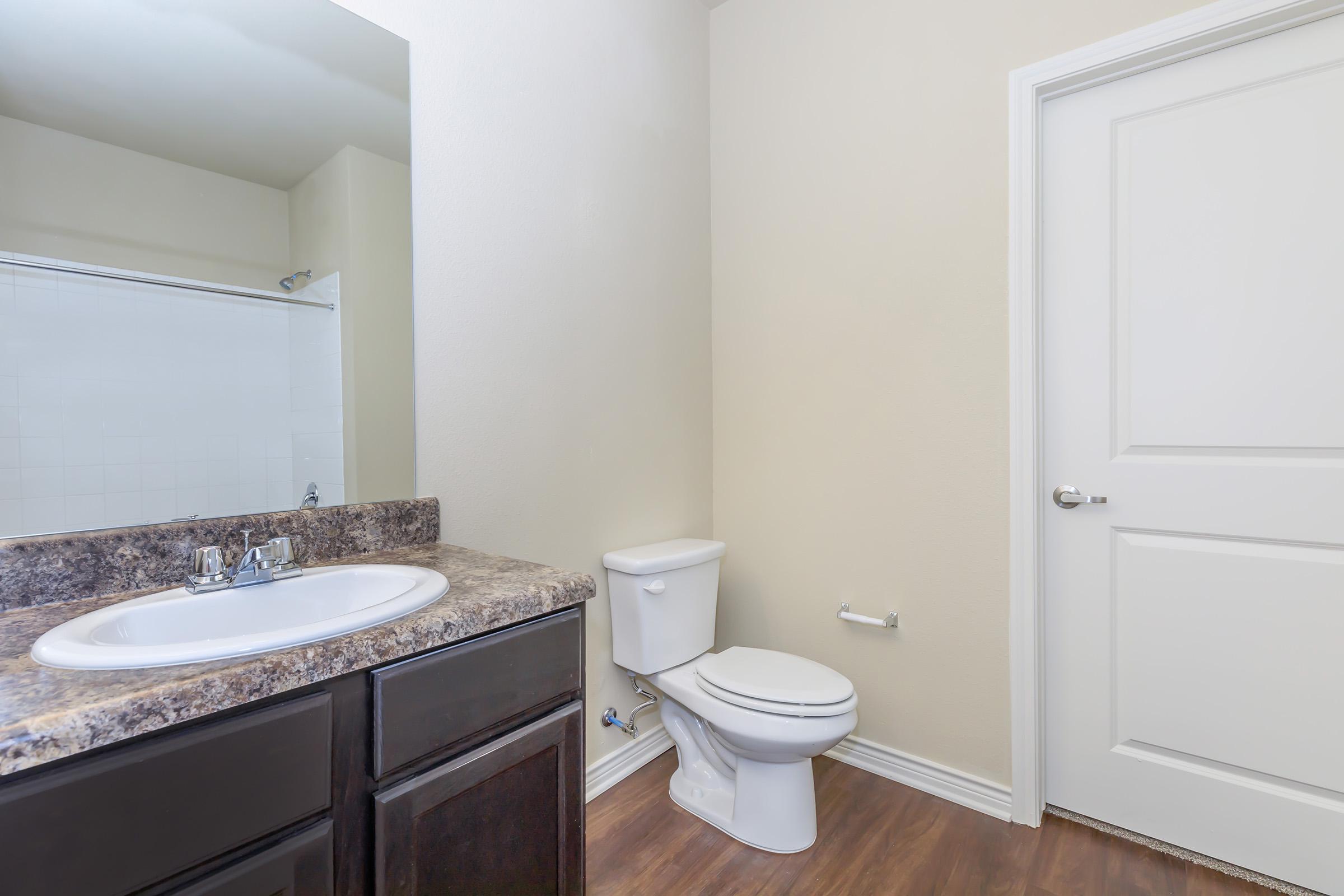 a kitchen with a sink and a mirror