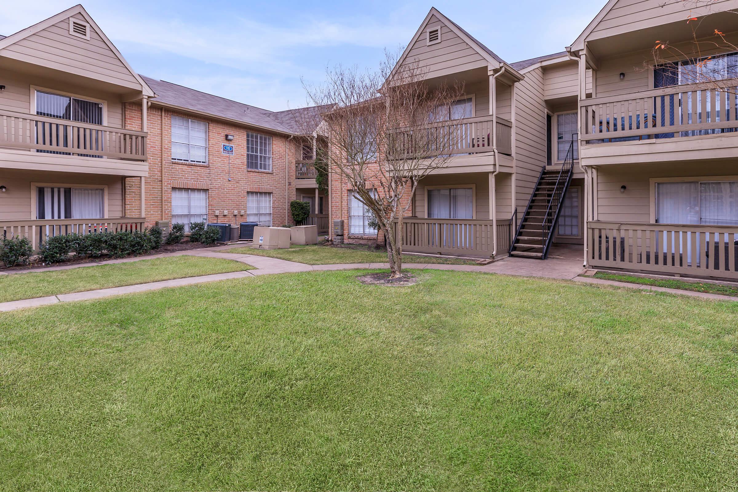 a large lawn in front of a house