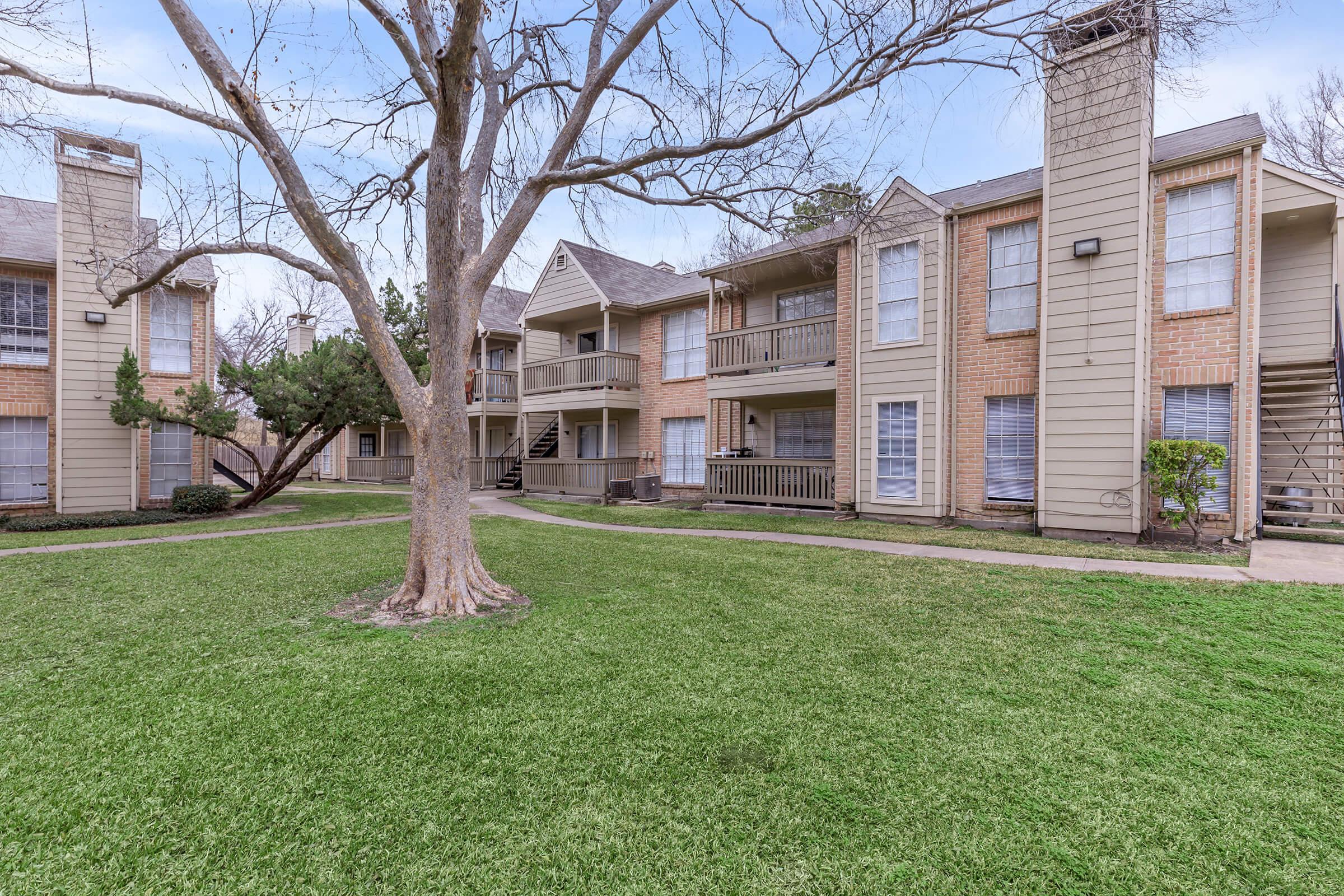 a large lawn in front of a house