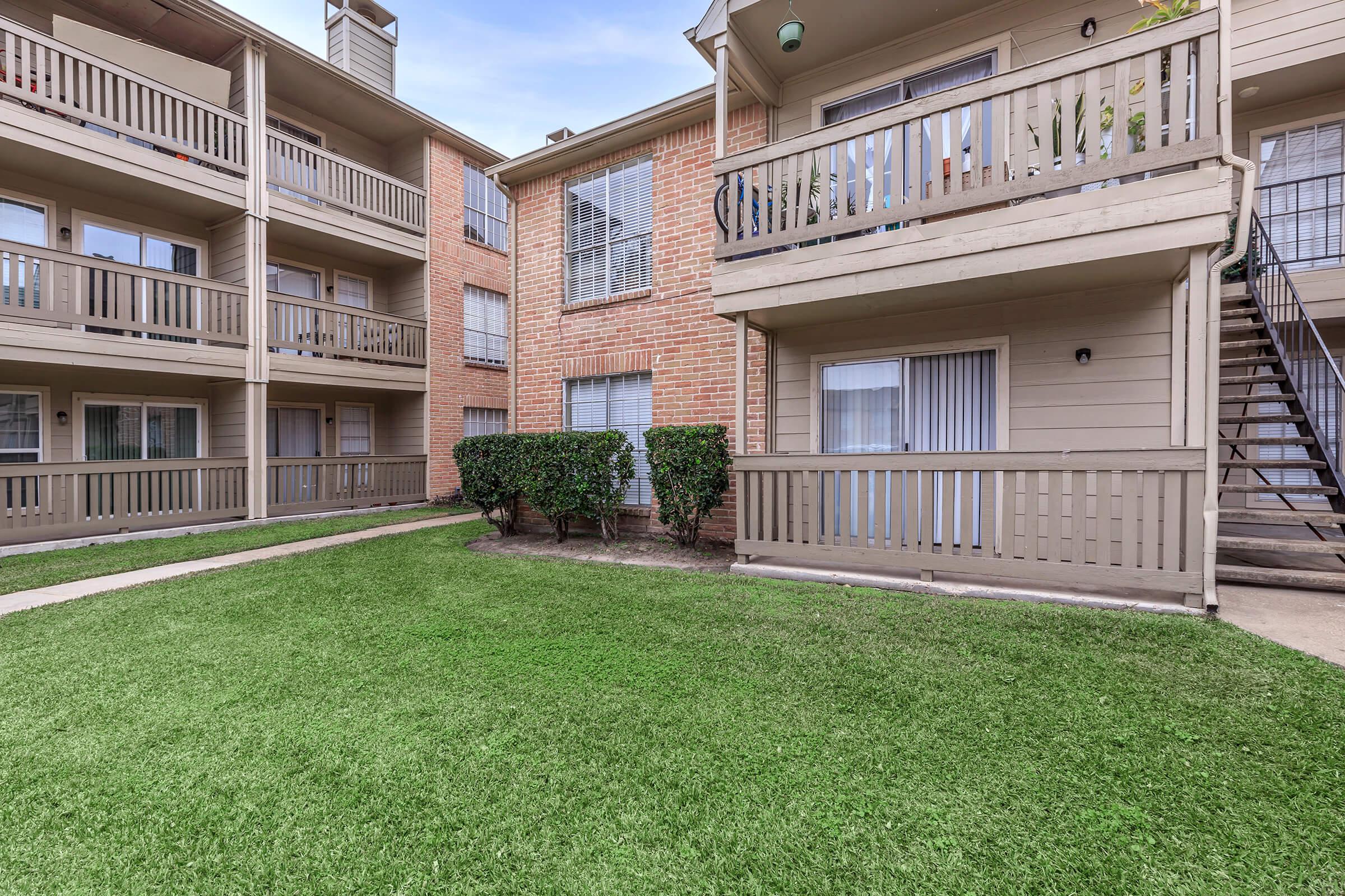 a large lawn in front of a building