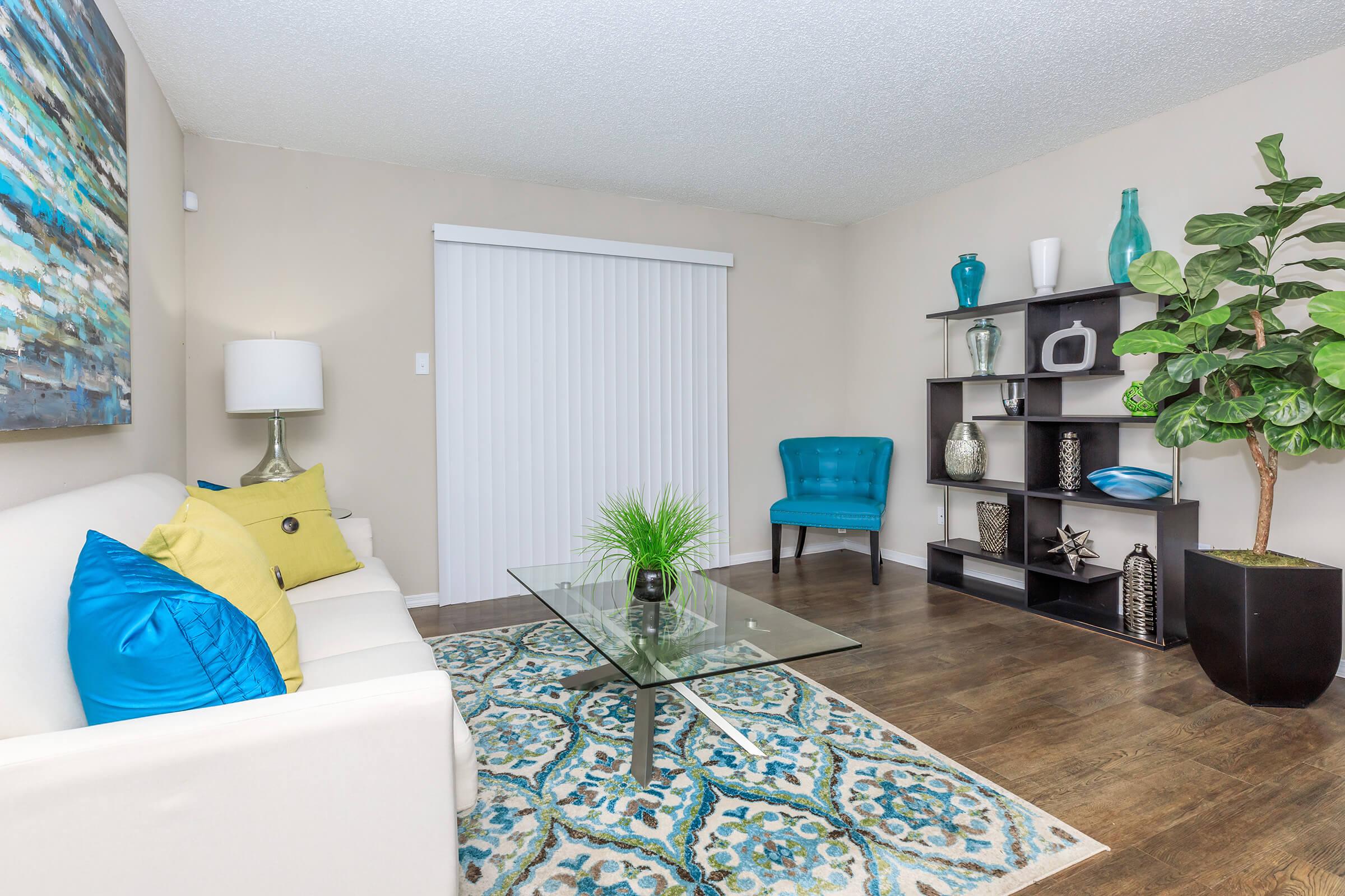 a living room filled with furniture and decor