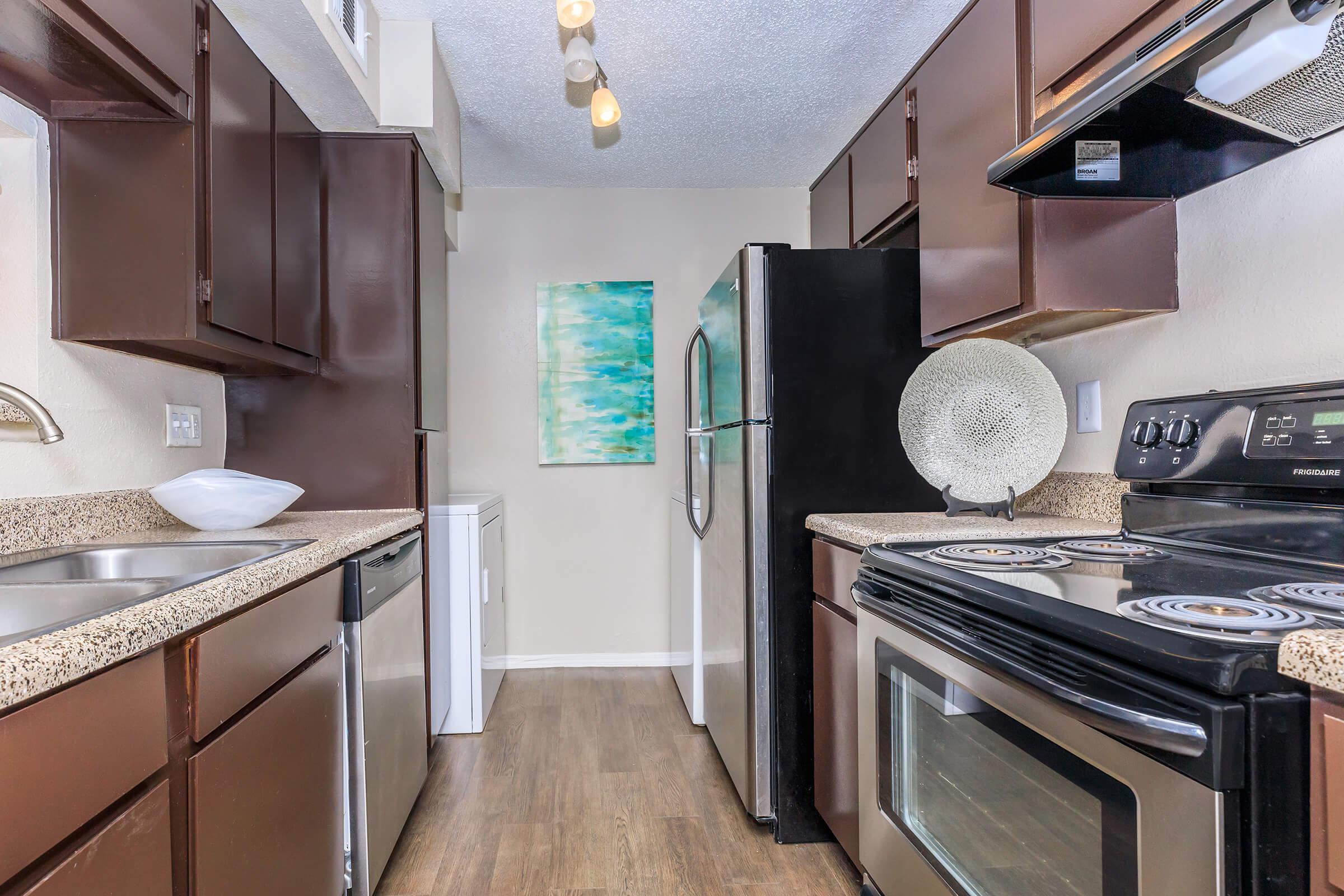 a kitchen with a stove and a sink