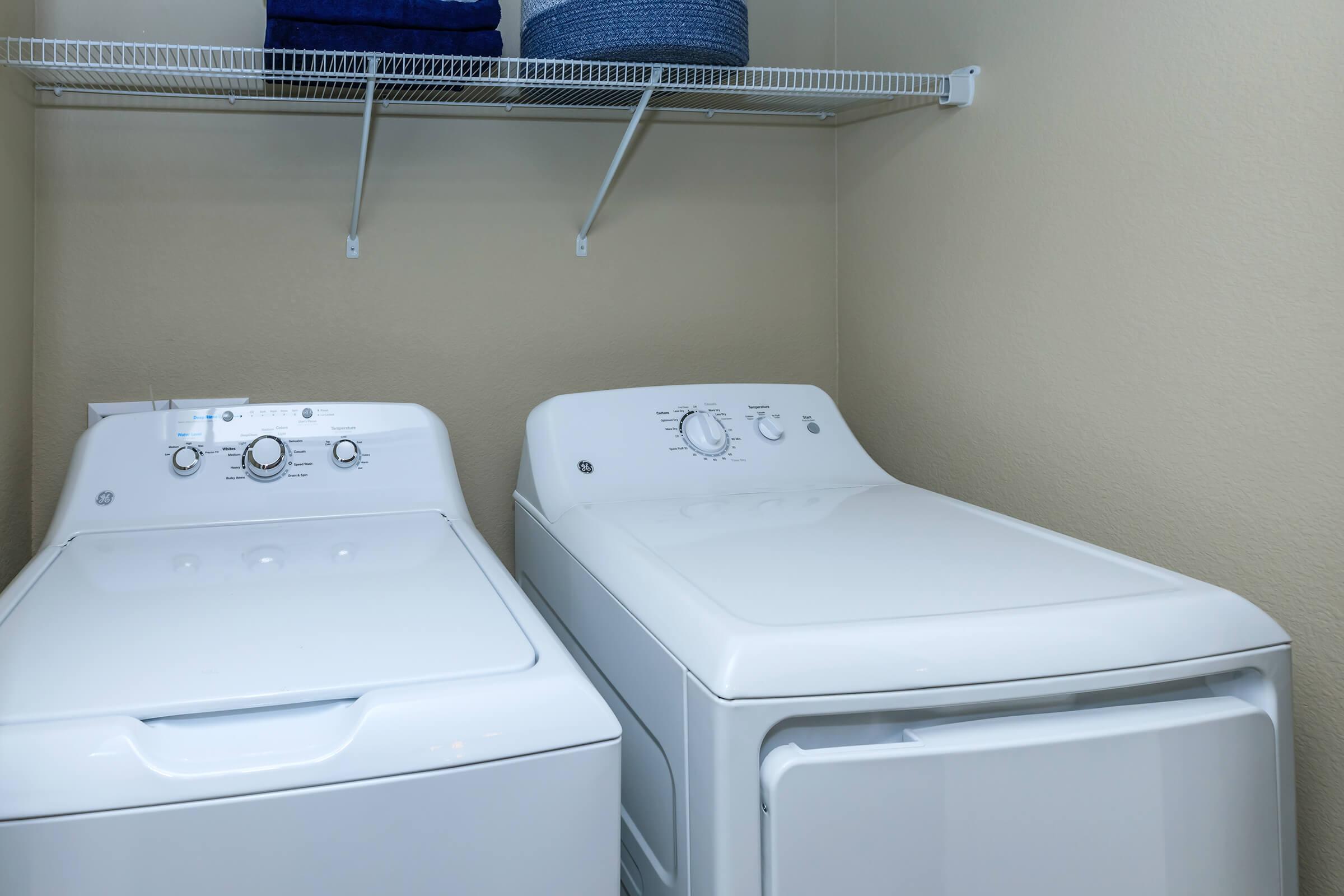 White washer and dryer in laundry closet