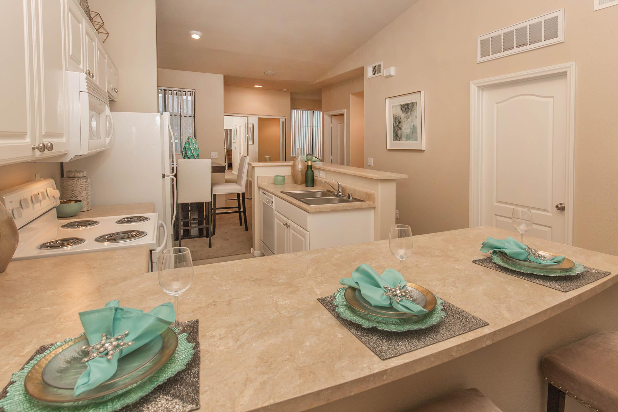 a kitchen with a table in a room