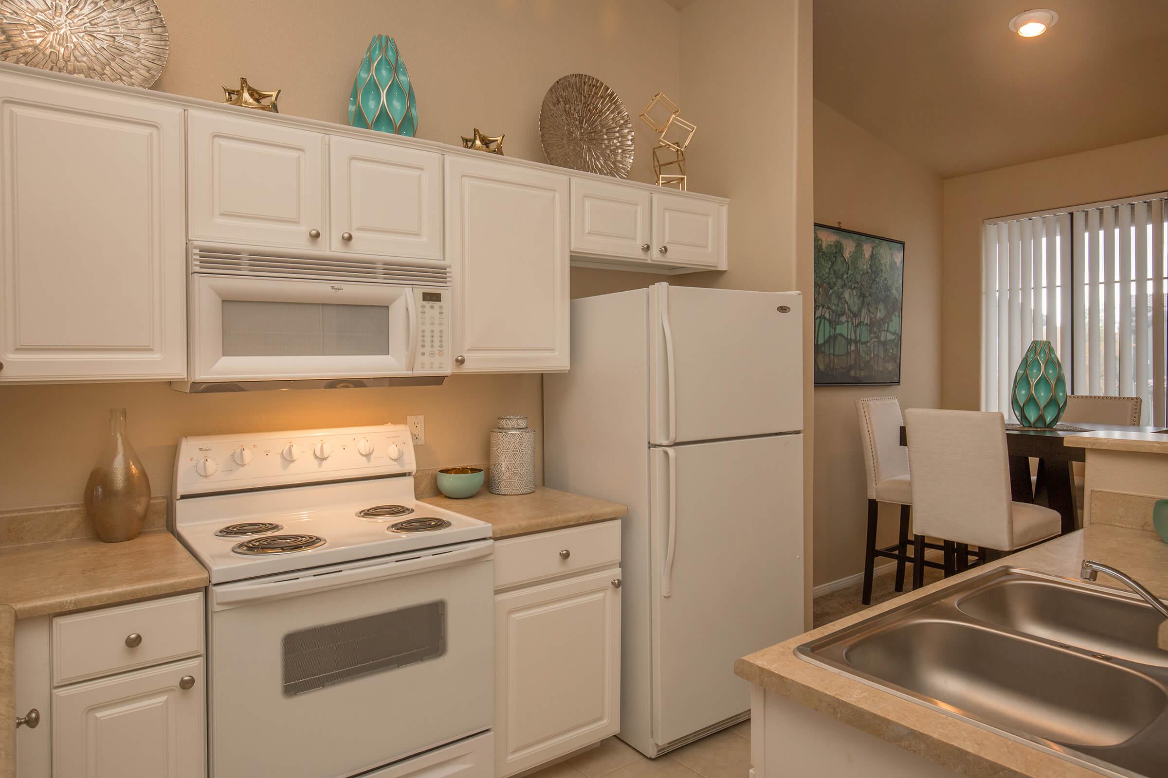 a kitchen with a sink and a microwave