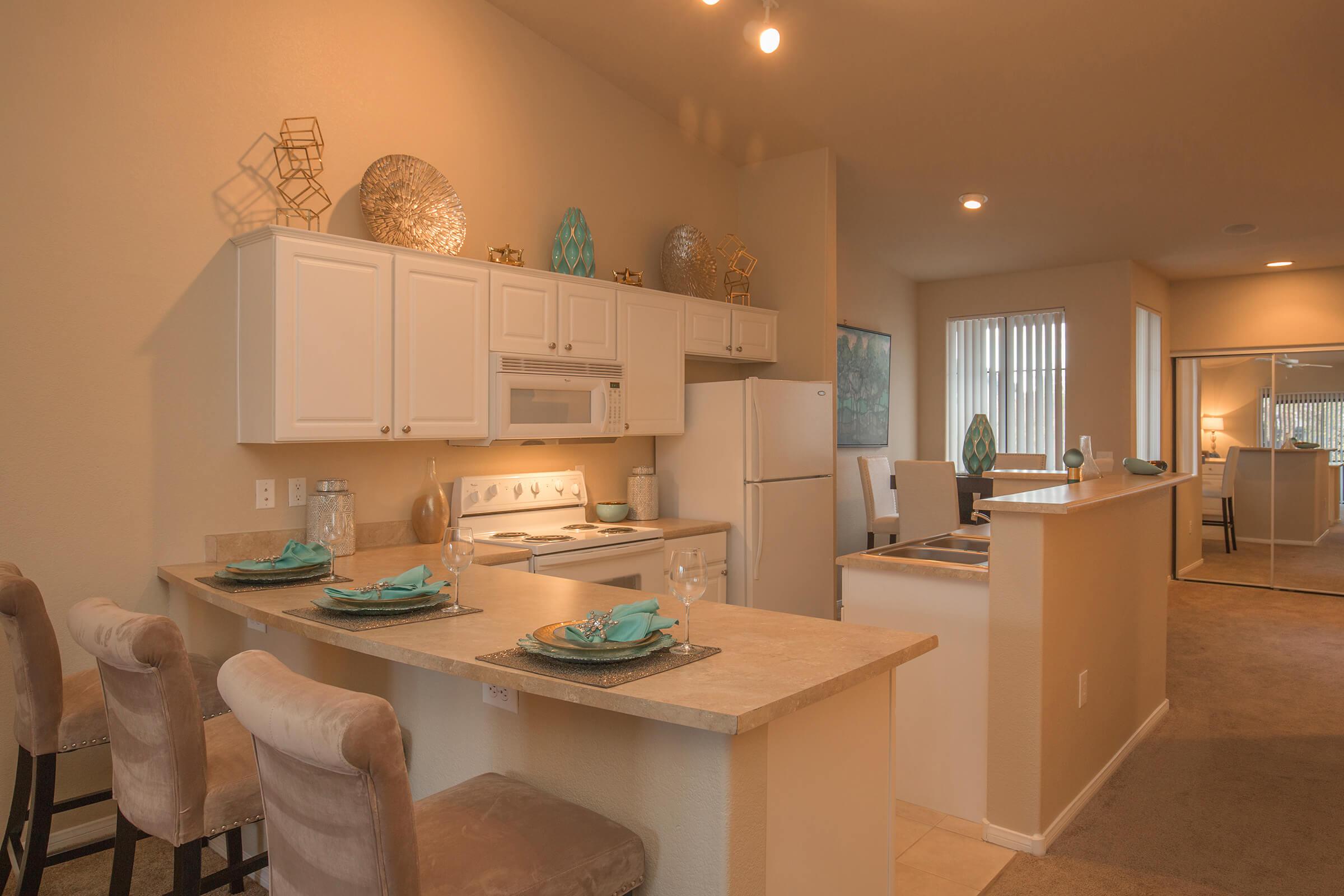 a kitchen with an island in the middle of a room