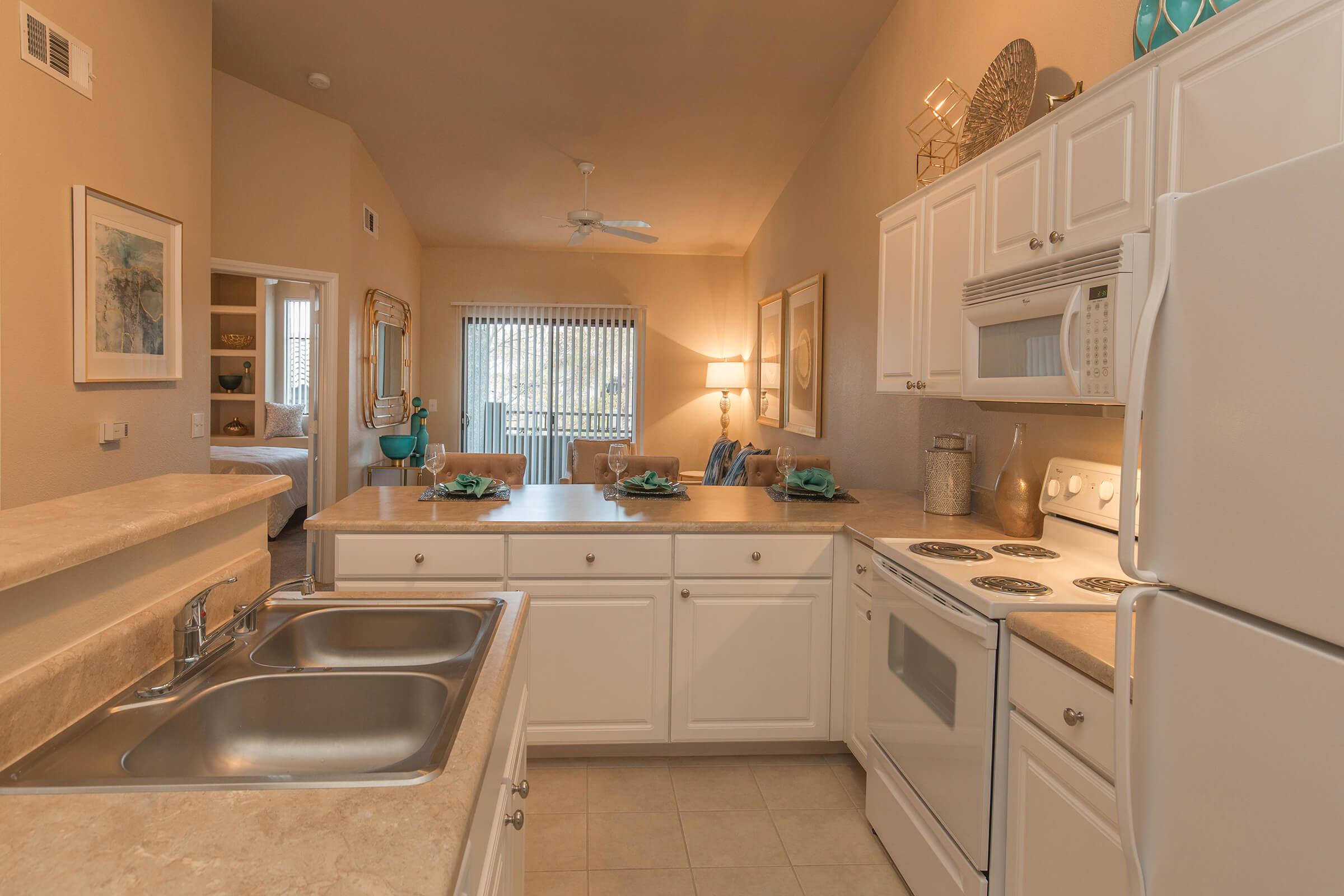 a kitchen with a sink and a window