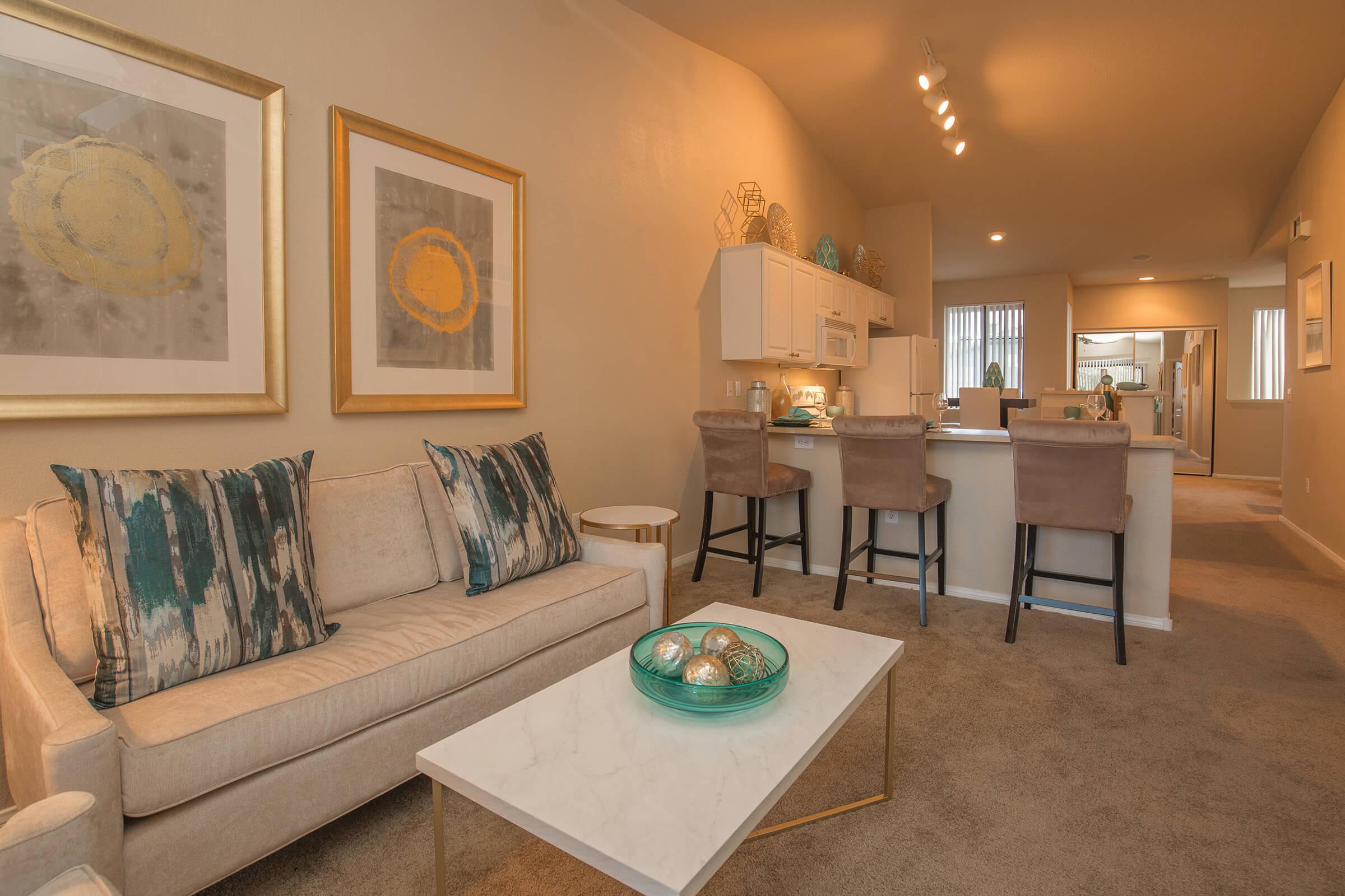 a living room filled with furniture and a table