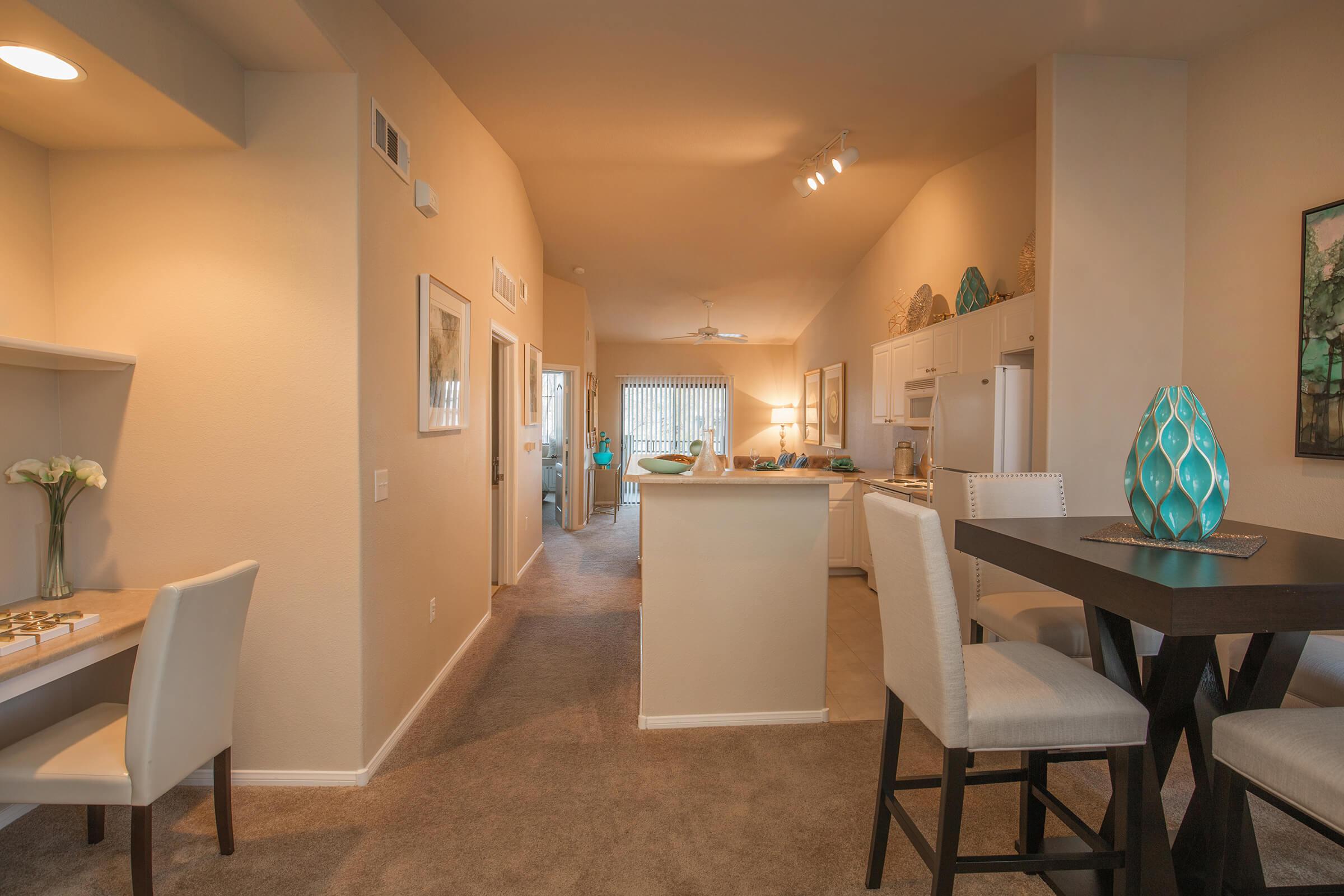 a room filled with furniture and a large mirror