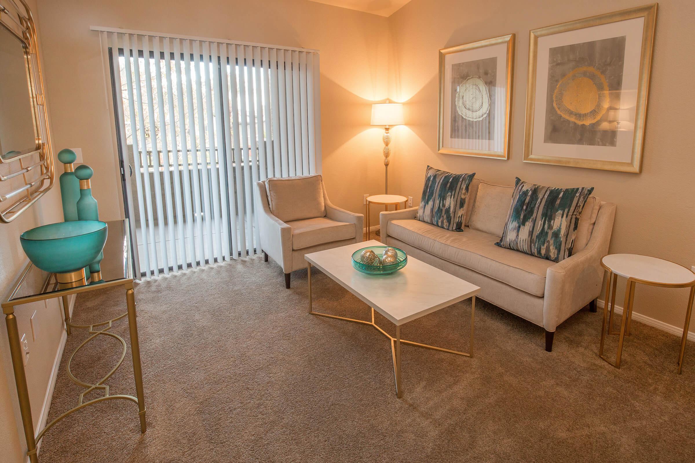 a living room with a couch and a chair