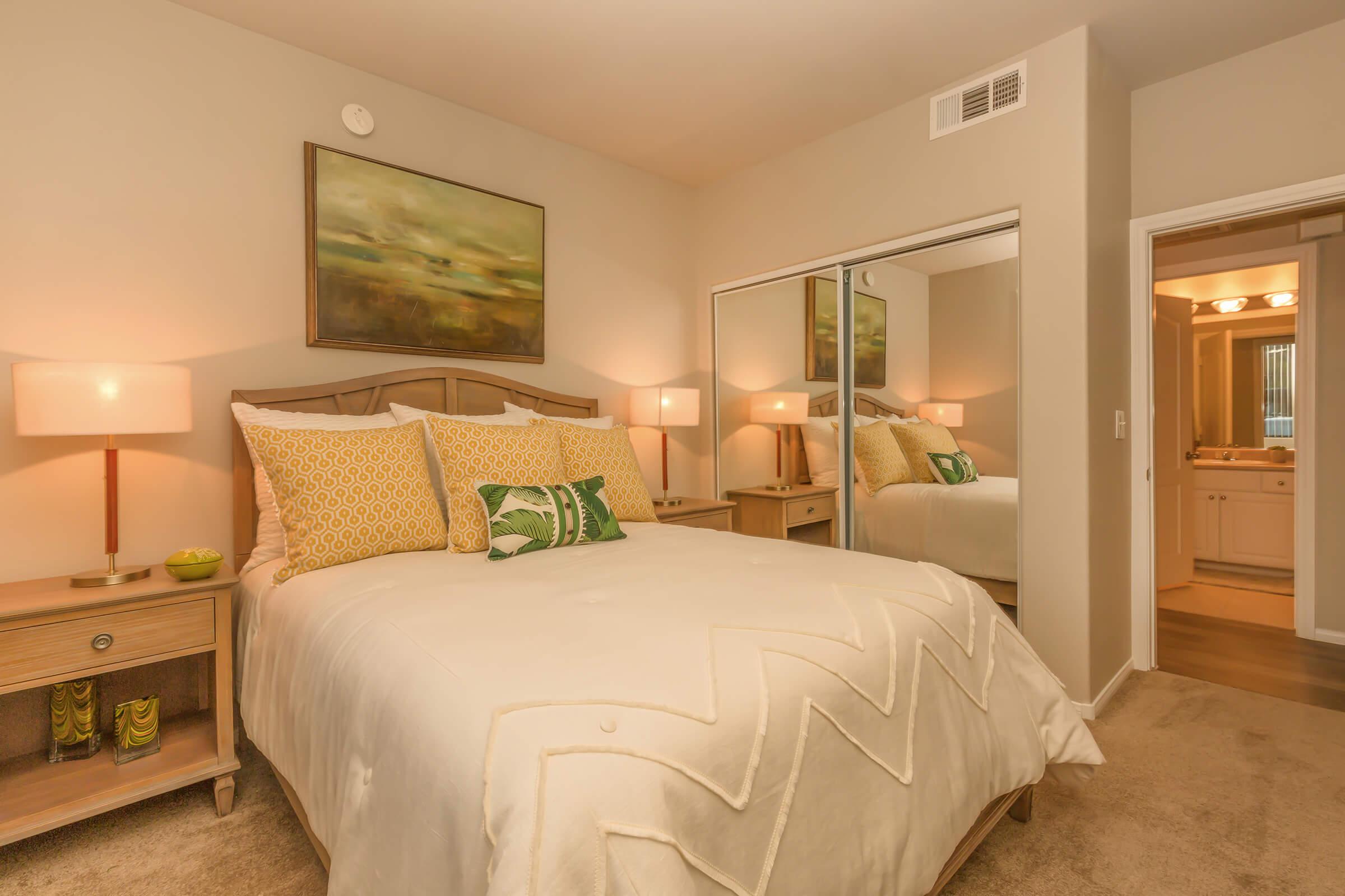 a bedroom with a large bed in a hotel room