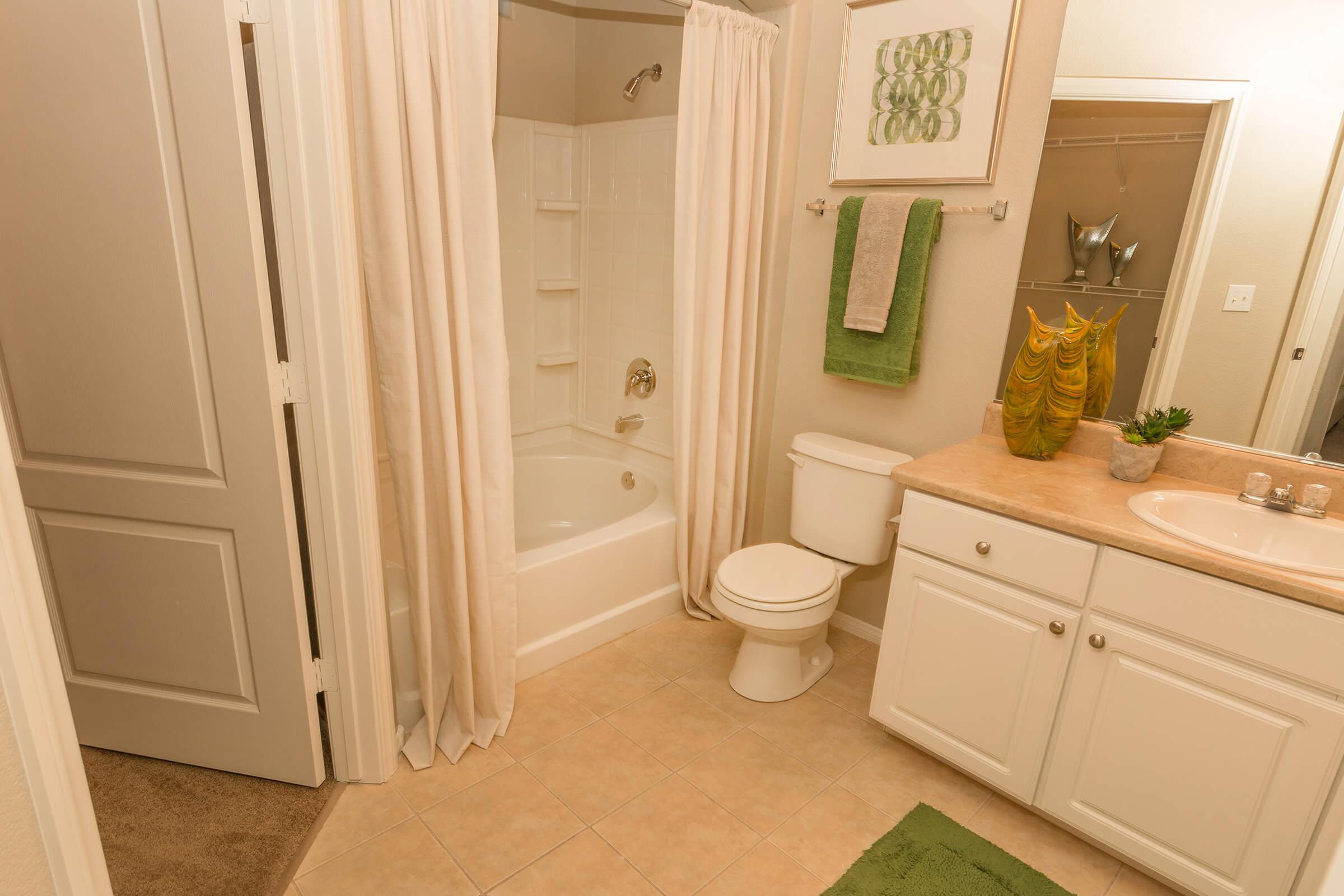 a white sink sitting next to a door