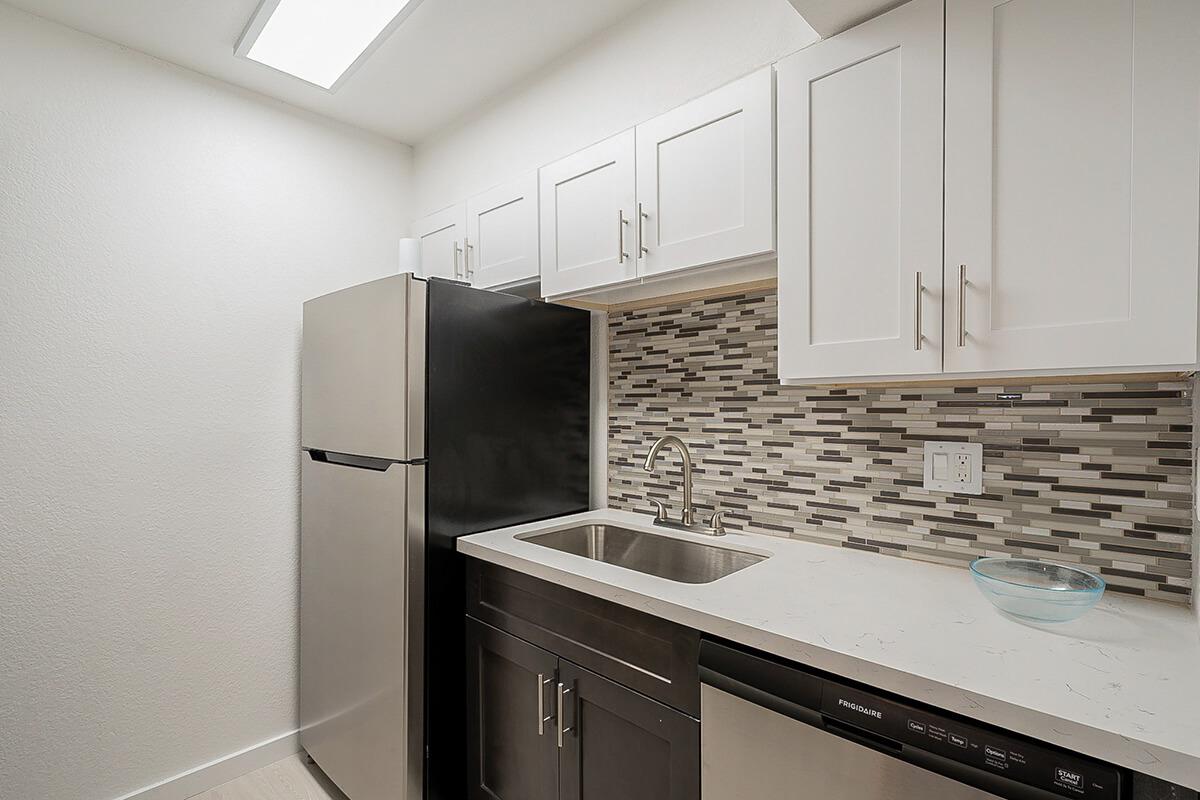 a kitchen with a sink and a microwave