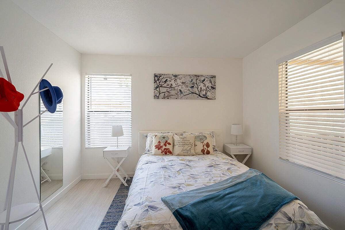 a bedroom with a bed in a room