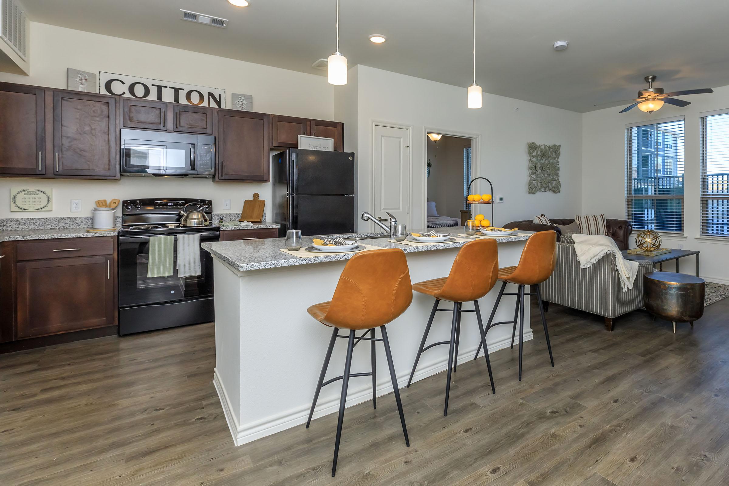 a kitchen with a table in a room