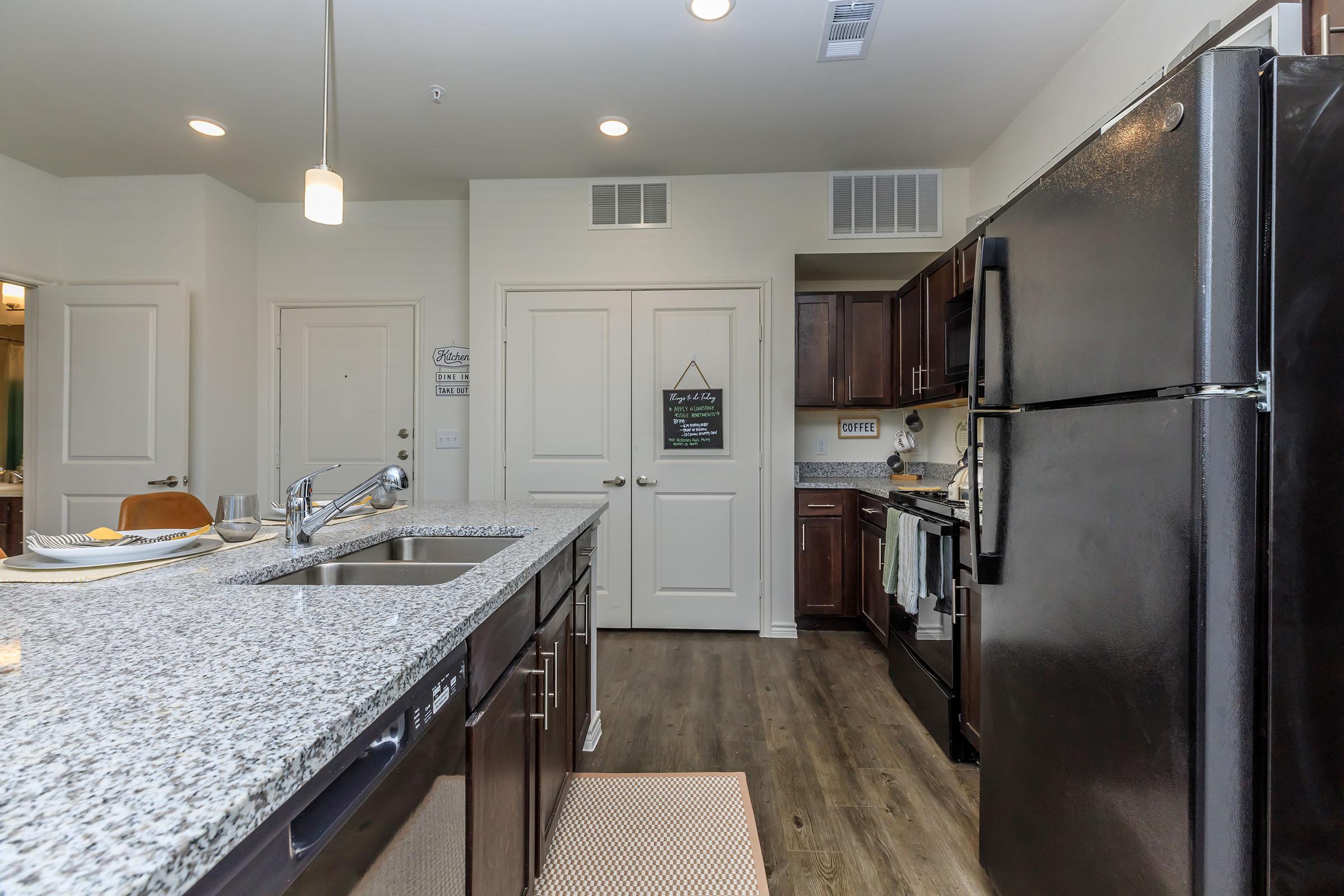 a large kitchen with stainless steel appliances