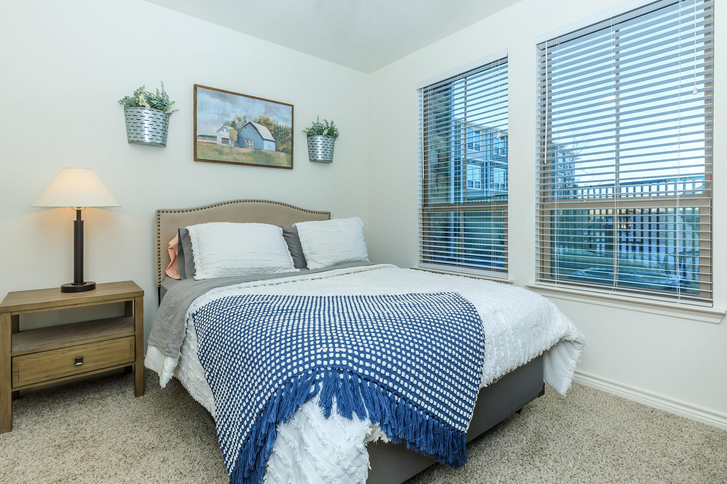 a bedroom with a large bed in a room