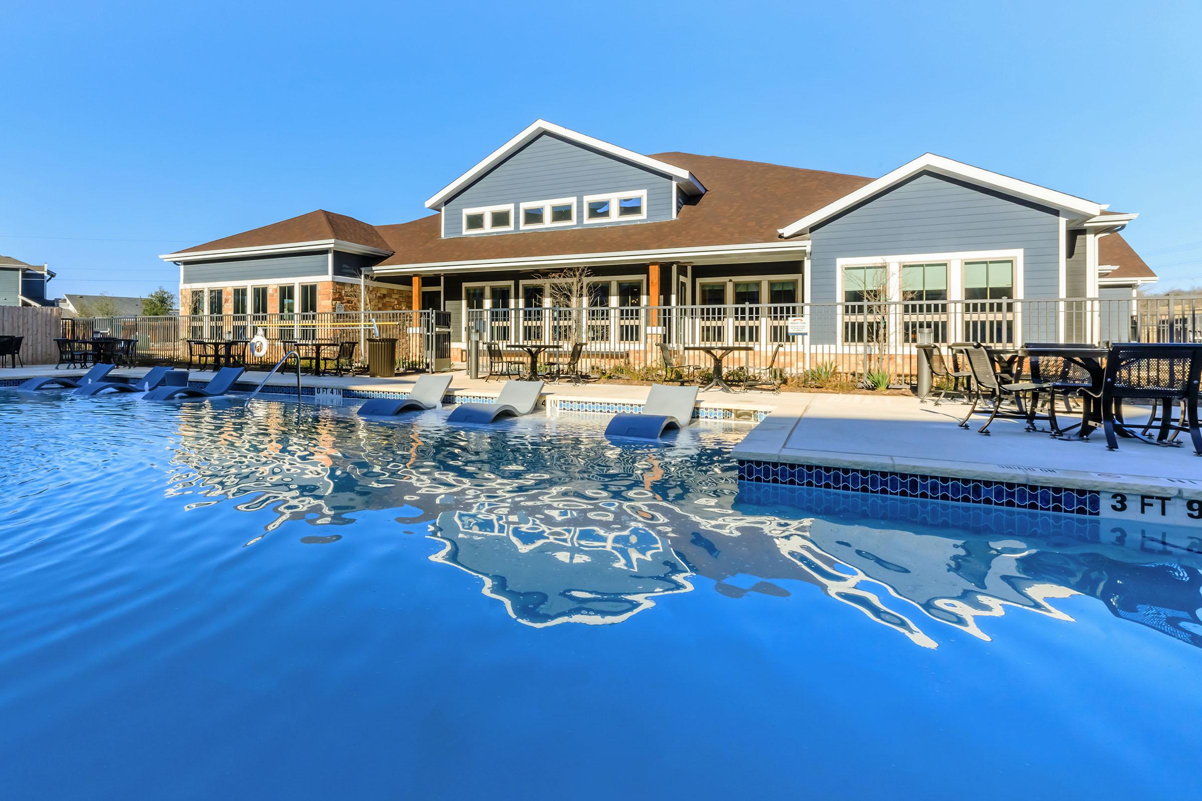 a house with a large pool of water