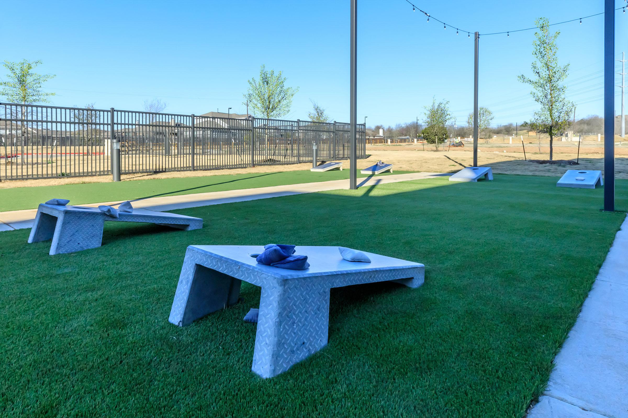 a bench is sitting in the grass