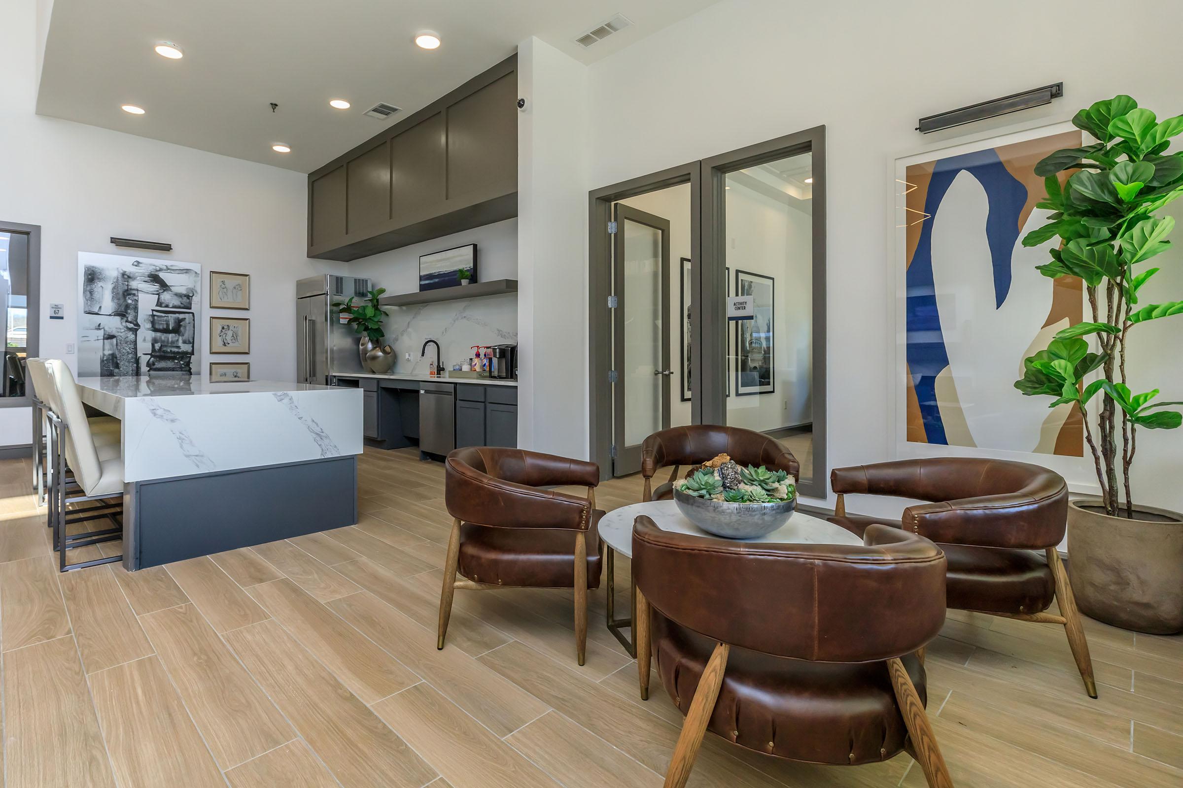 a living room filled with furniture and a table