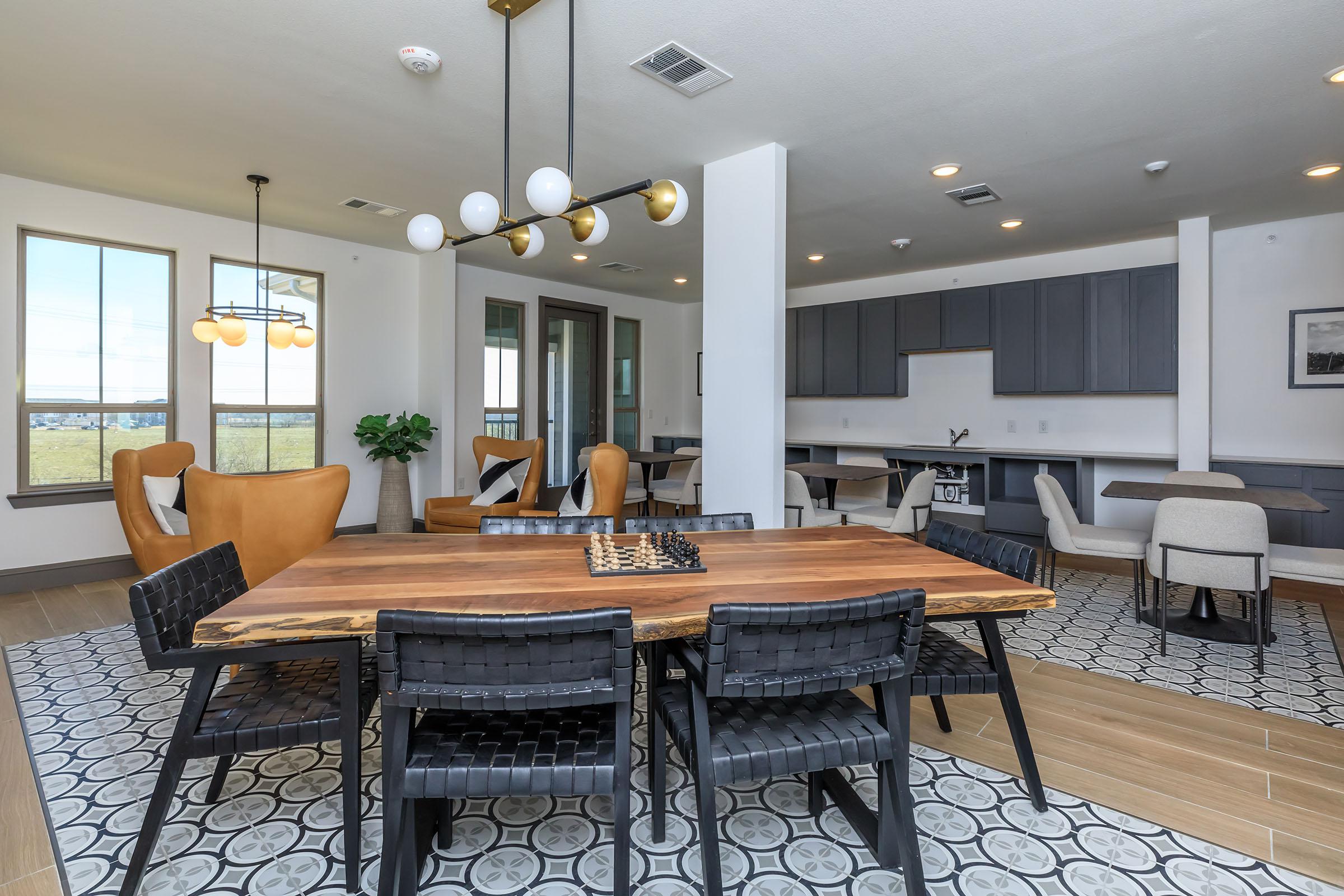 a living room filled with furniture and a large window