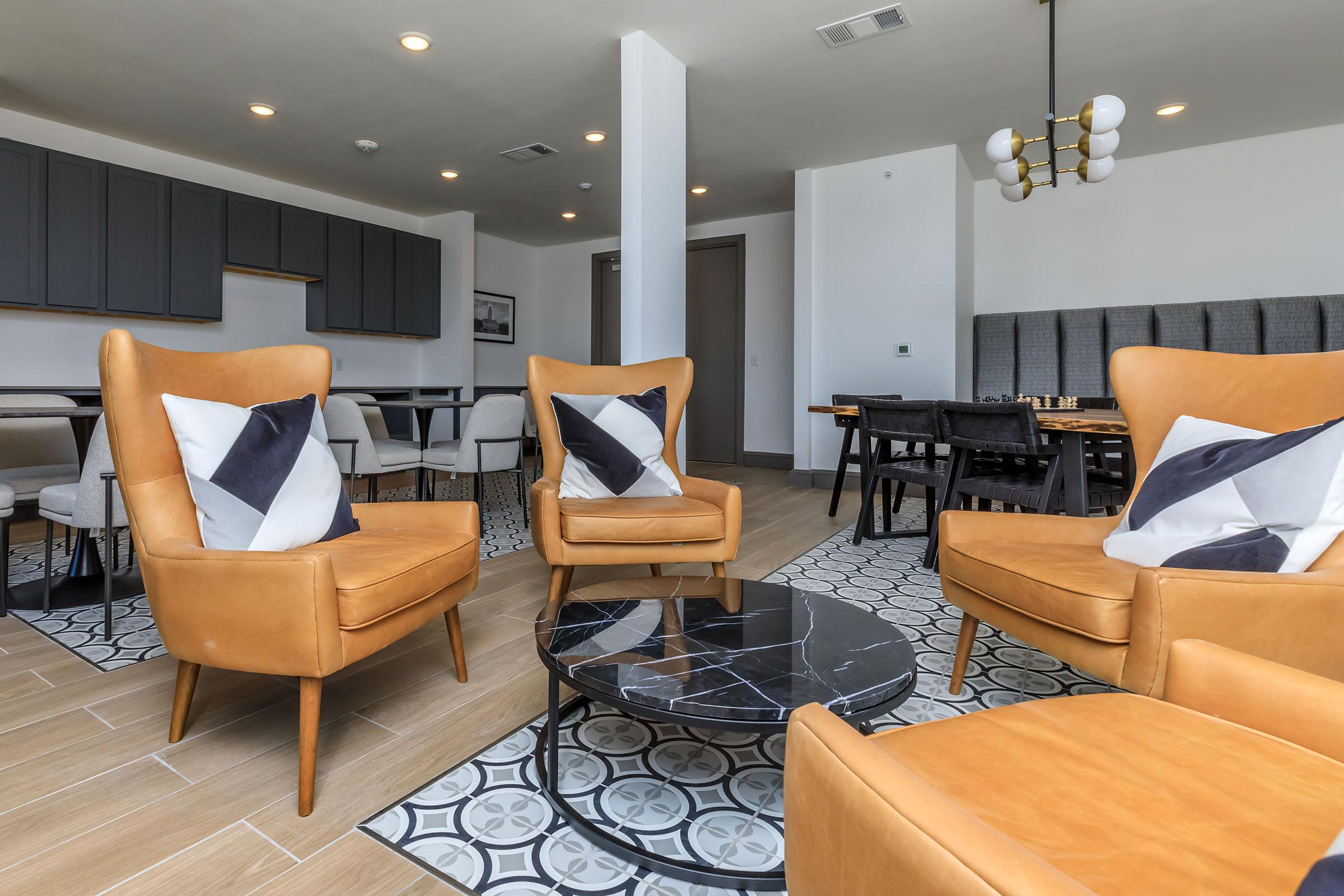 a living room filled with furniture and a table