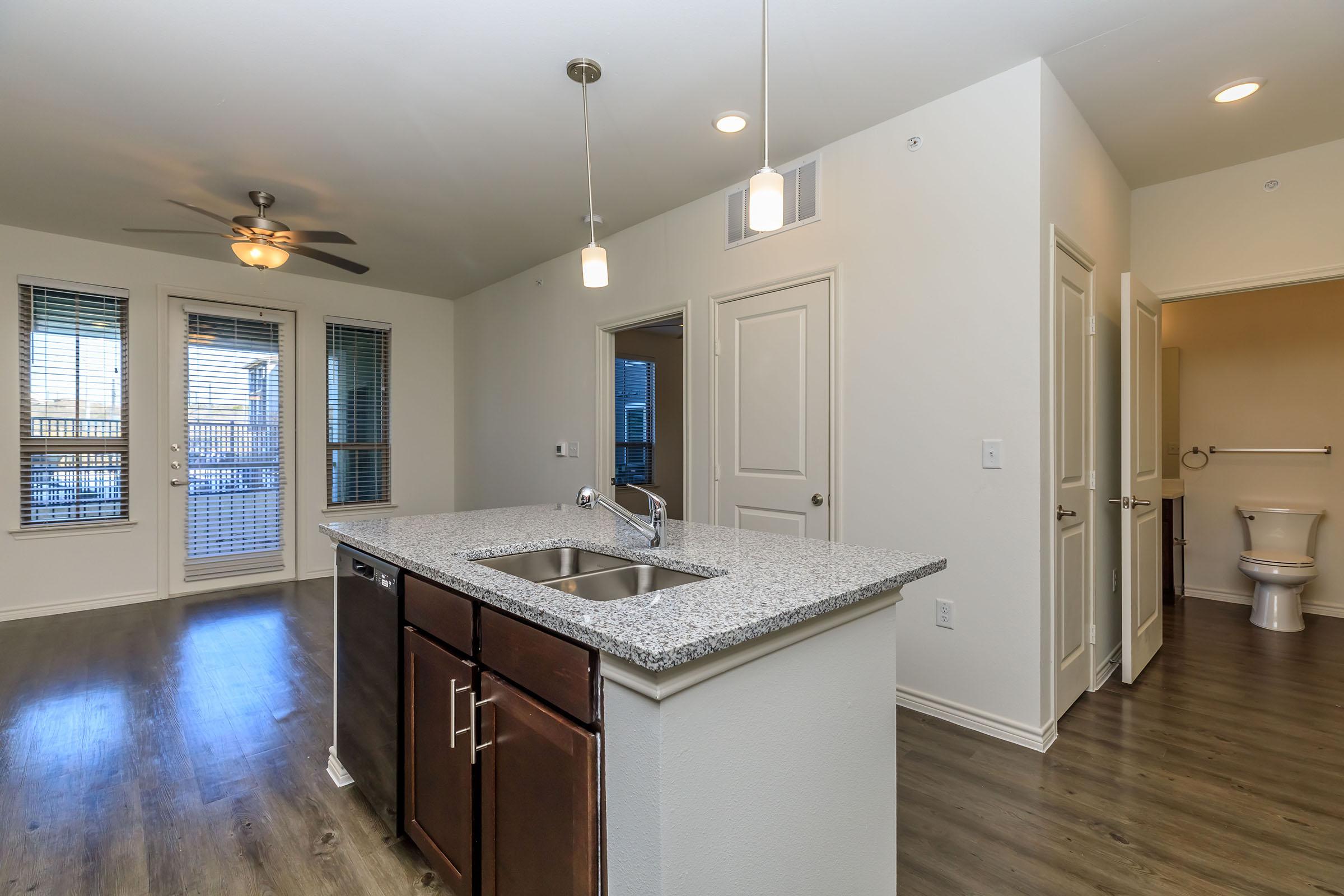 a kitchen with a sink and a window