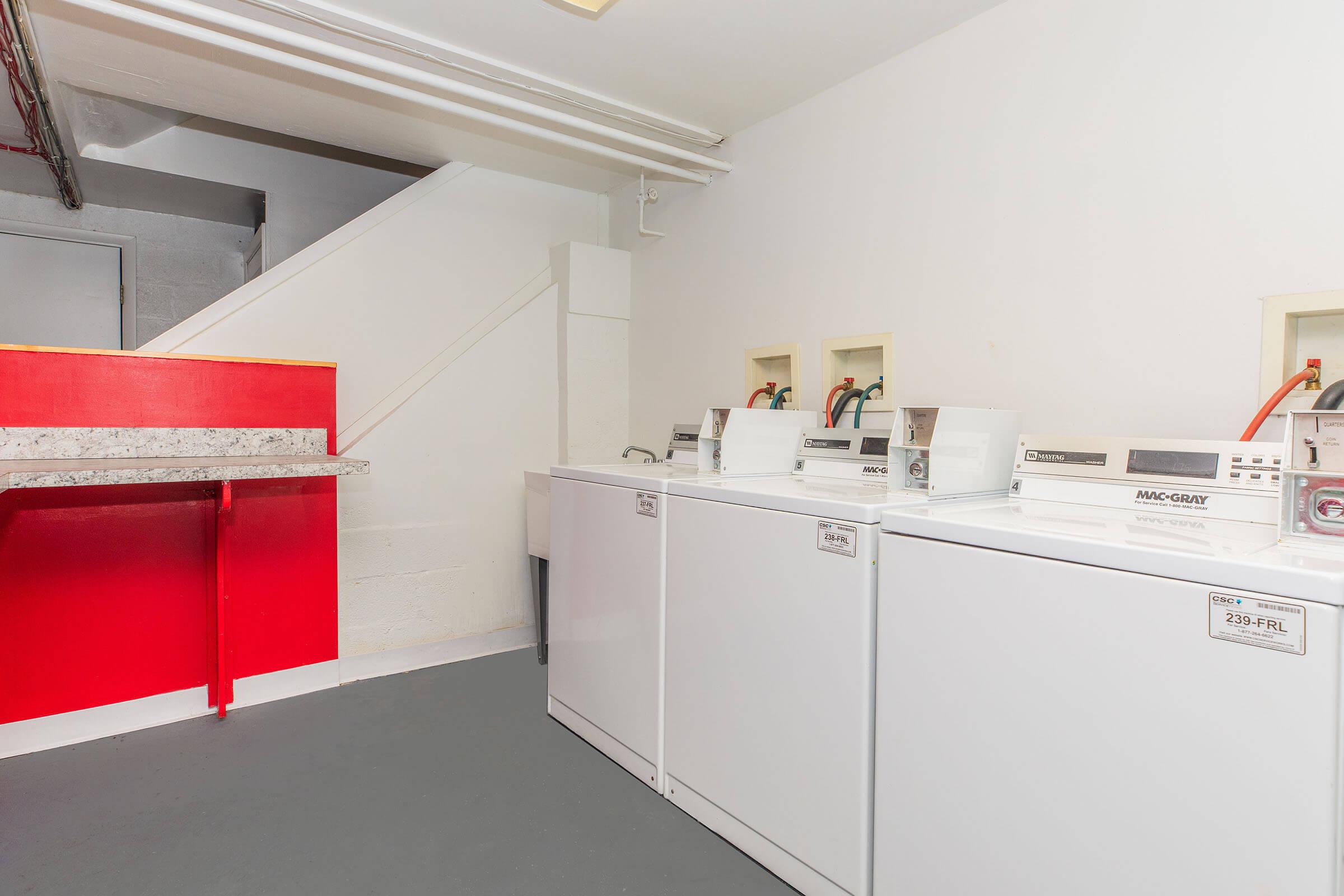 a kitchen with a stove and a refrigerator