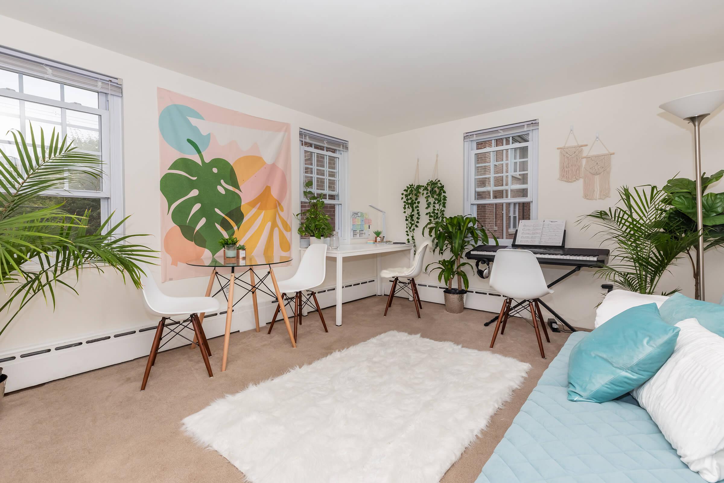 a living room filled with furniture and a flat screen tv