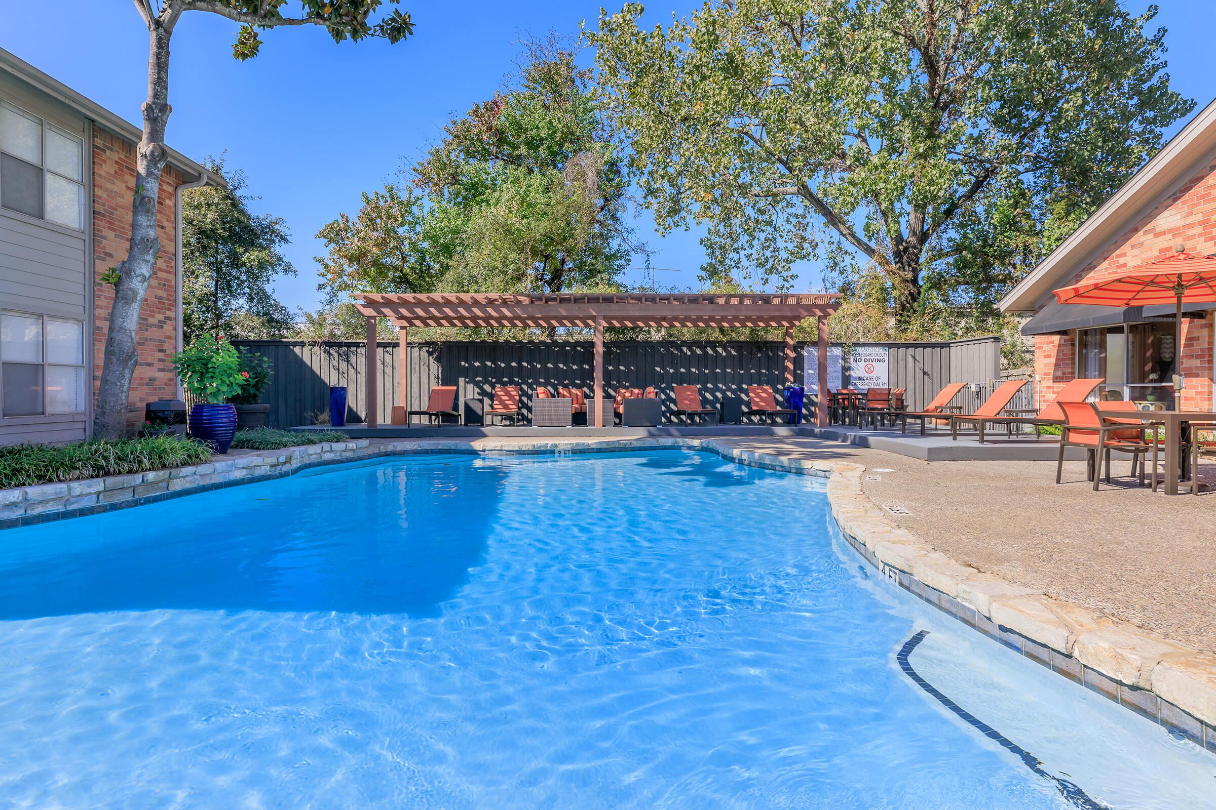 a house with a large pool of water