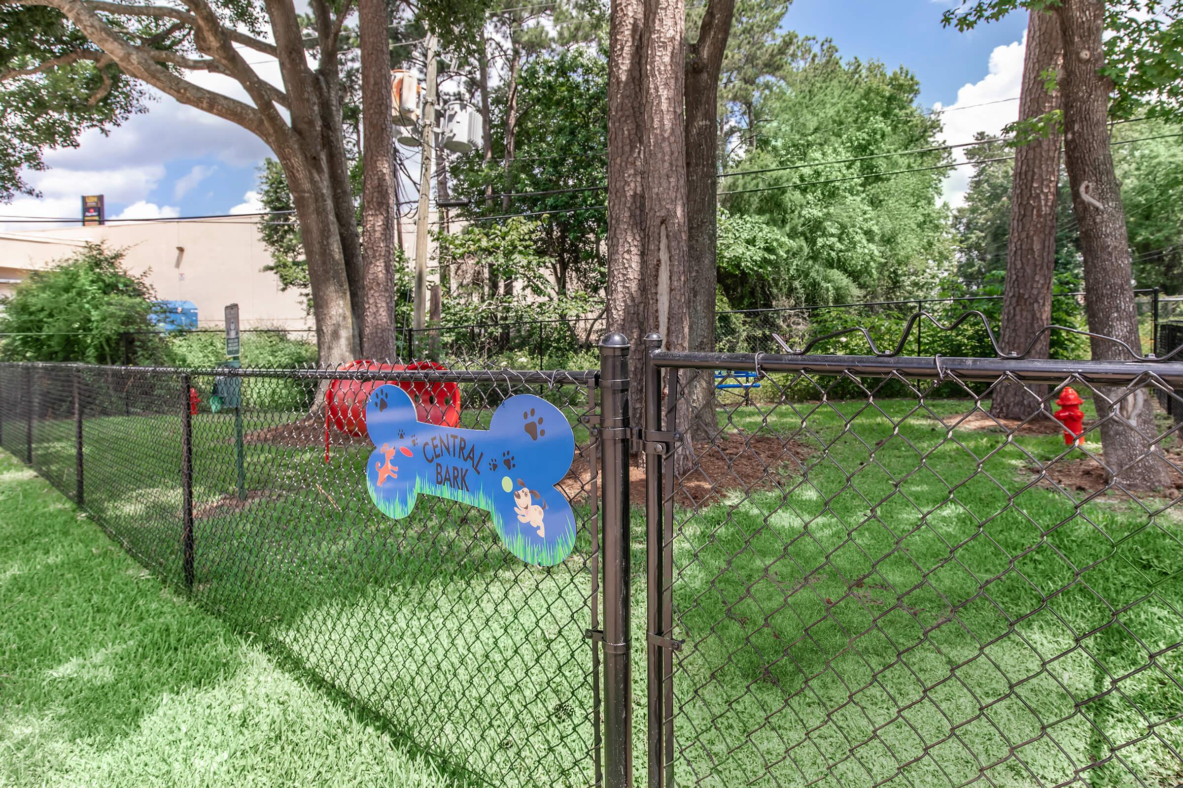 a sign on the side of a fence