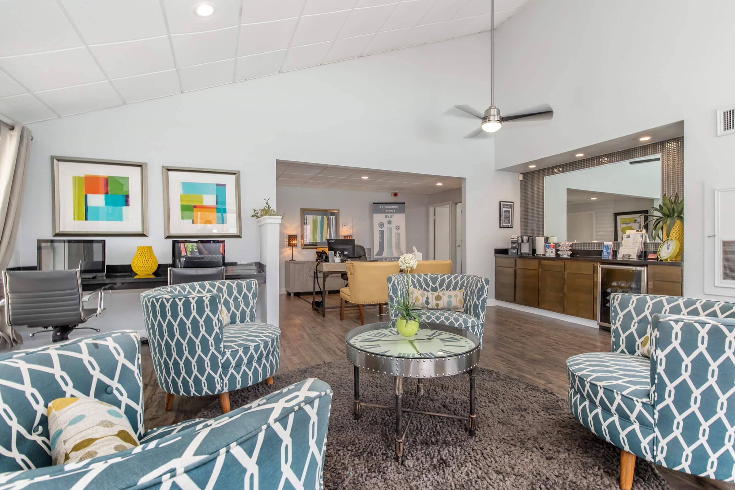 a living room filled with furniture and a fireplace