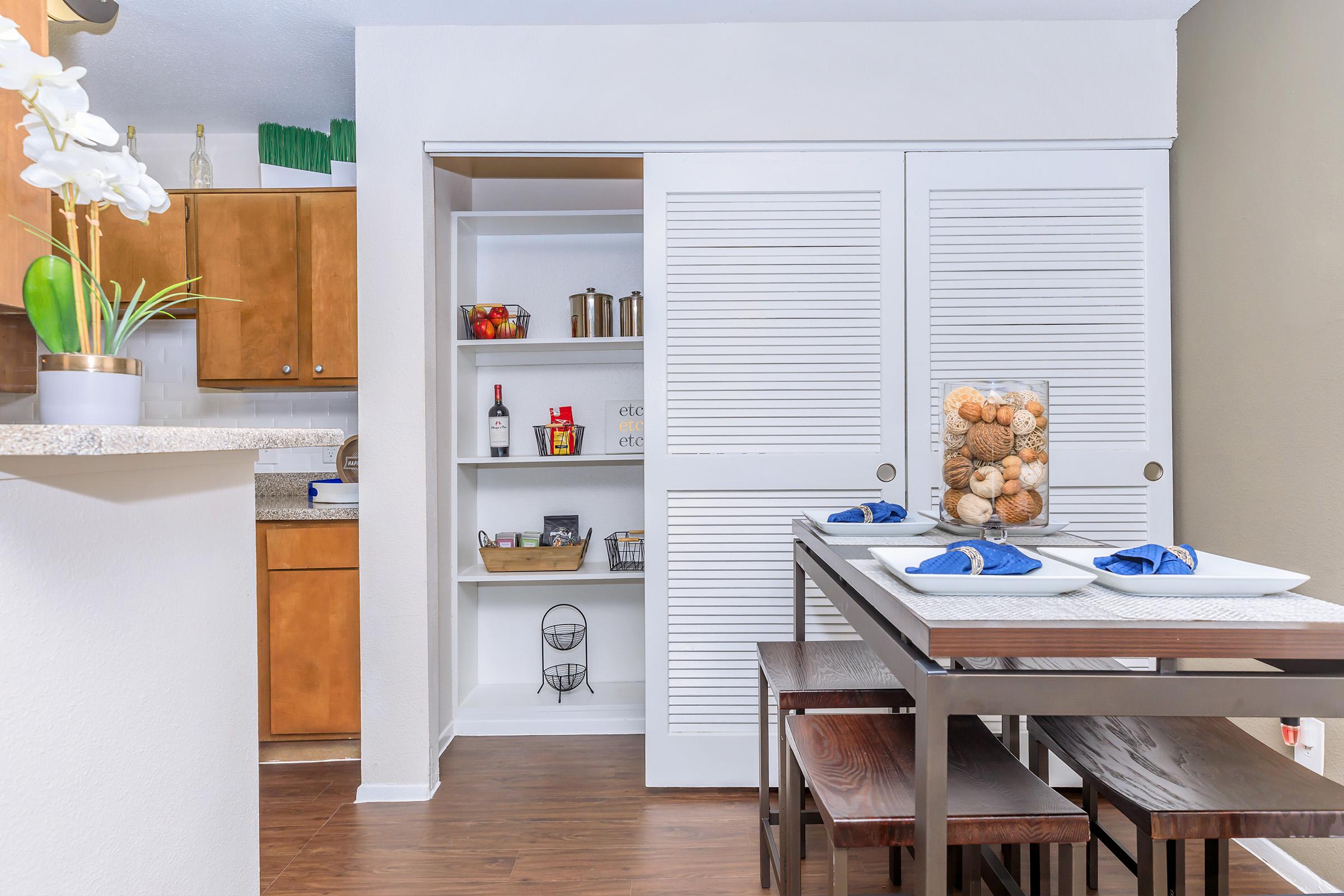 a kitchen with a table in a room