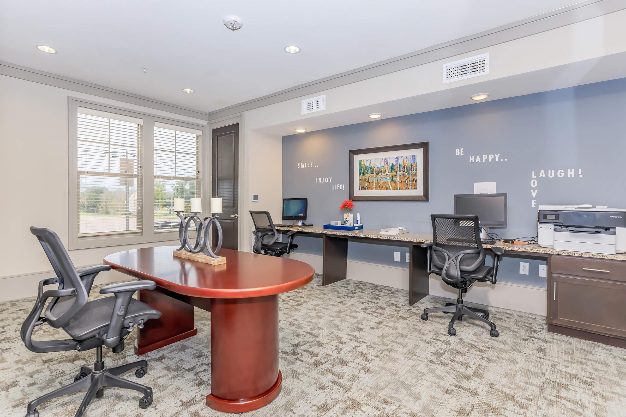 a room filled with furniture and a large window